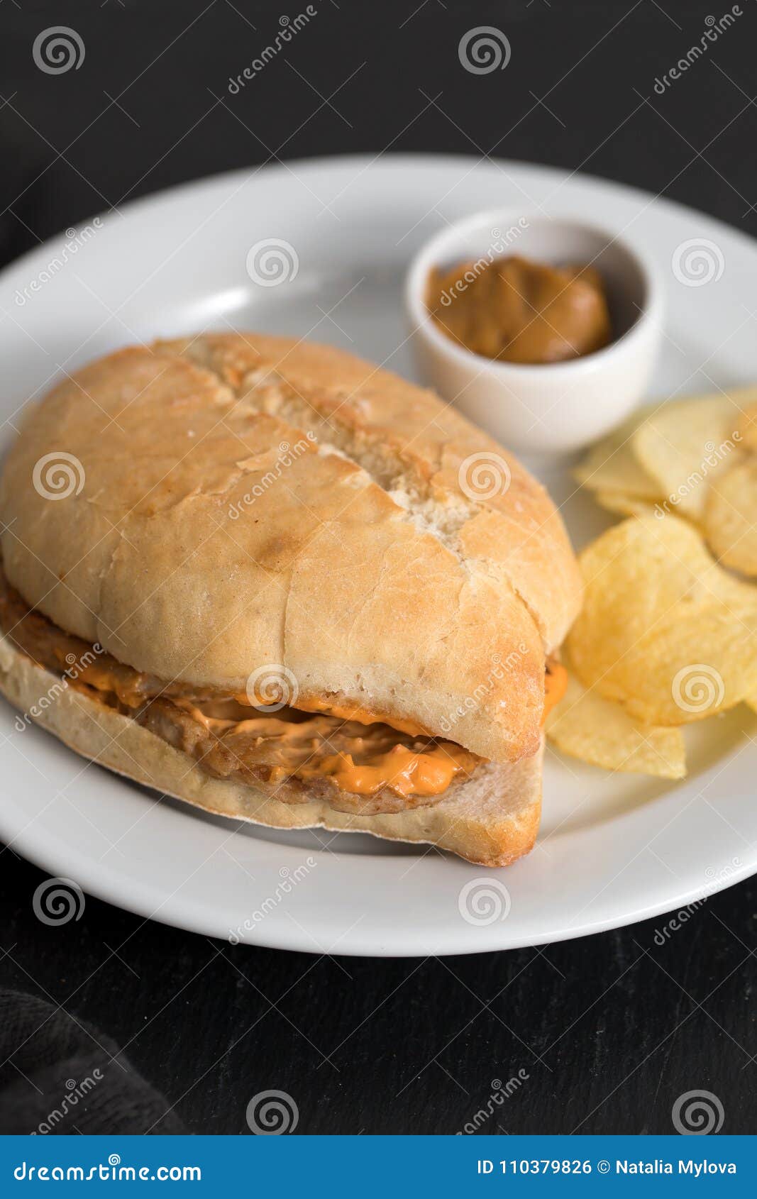 sandwich with meat and potato on plate