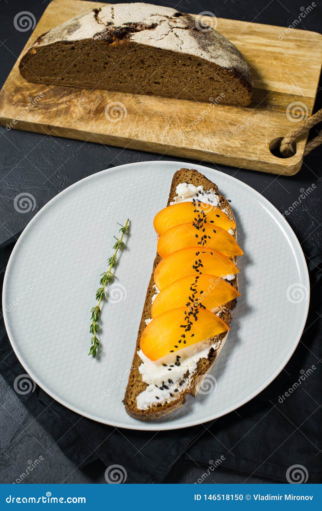Sandwich With Persimmon And Soft Cheese On A Black ...