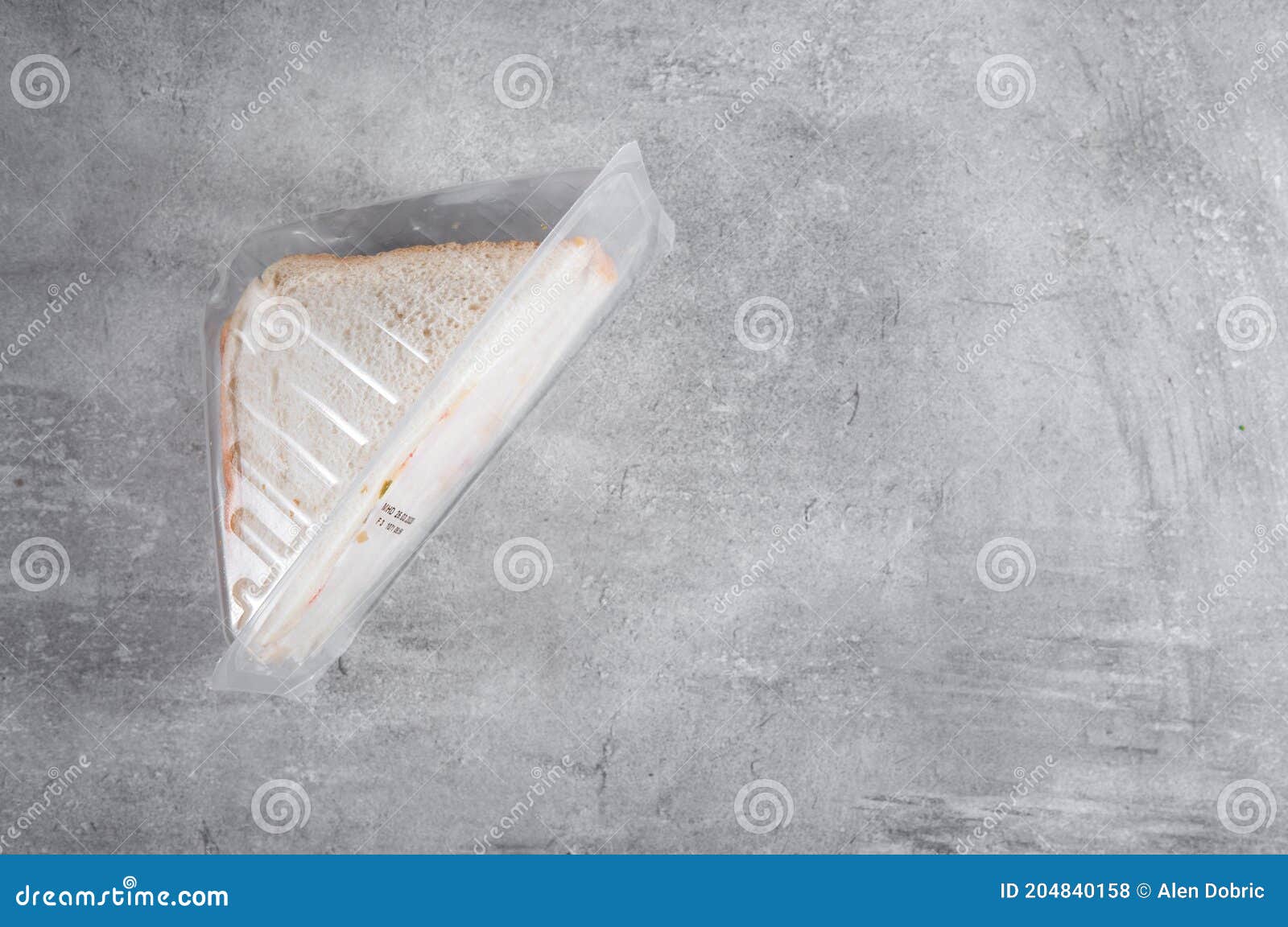 Sandwich in a Transparent Plastic Box or Nylon Bag To Go Stock