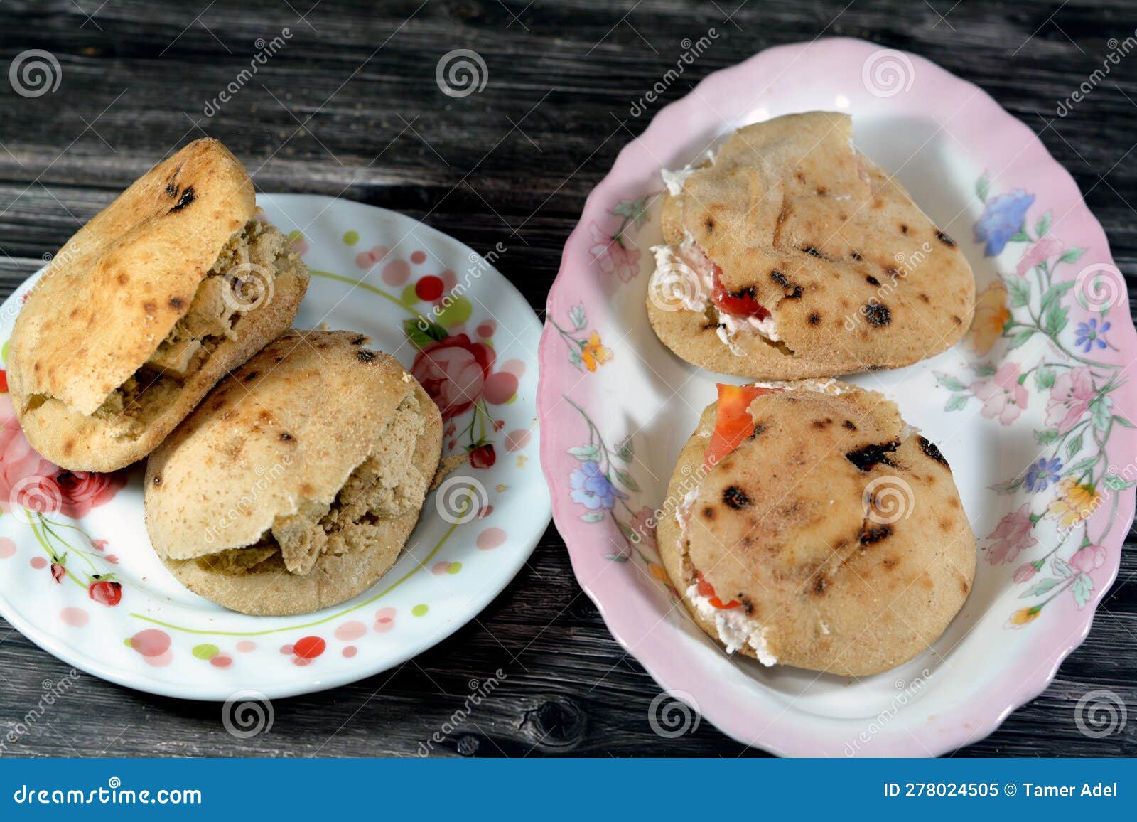 sandwiches of feta white cheese with slices of tomatoes and traditional plain tahini halva or halawa tahiniya as basic tahini and