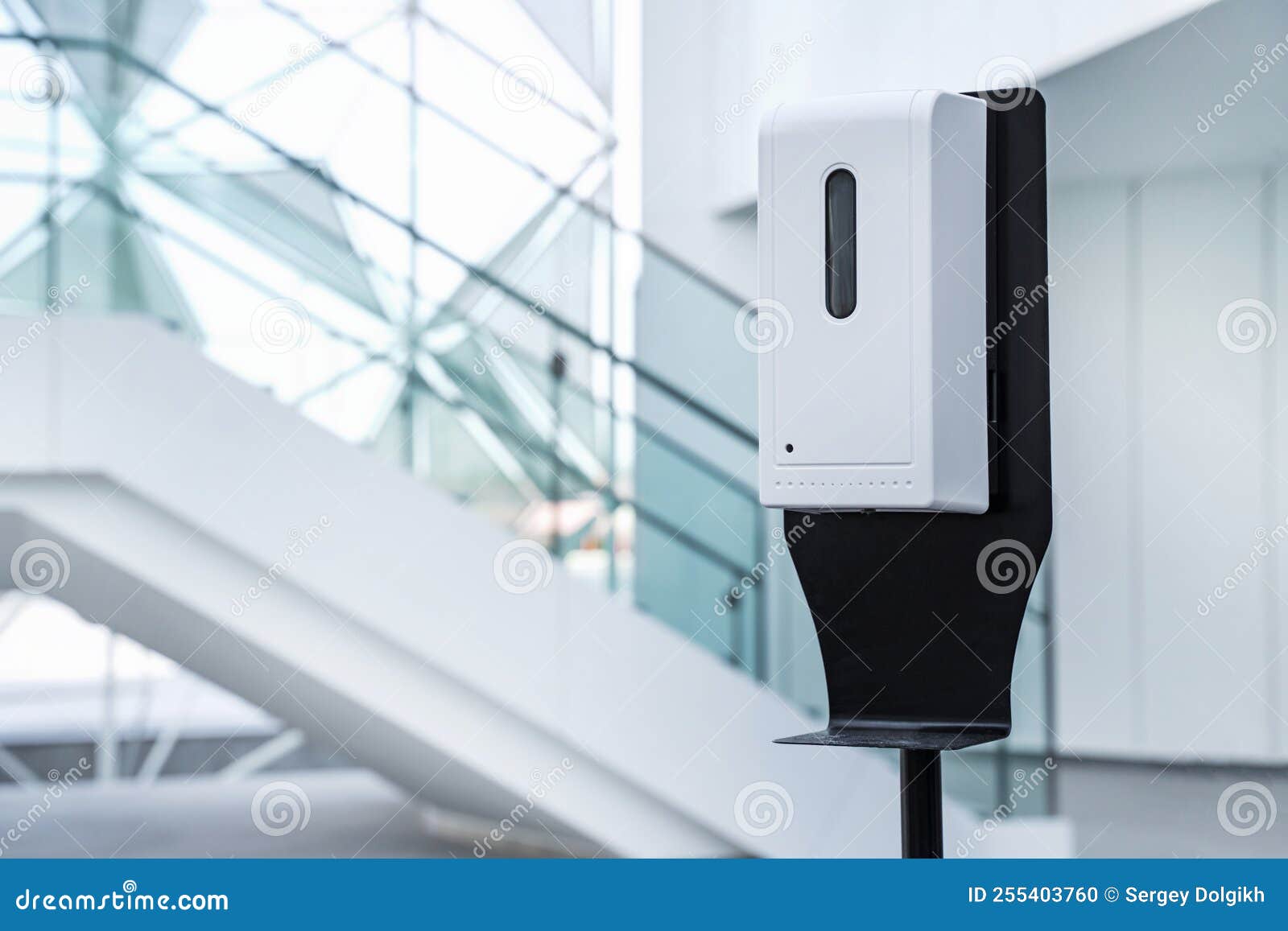 sanitizer gel in common areas. automatic supply of antibacterial lotion. close-up.