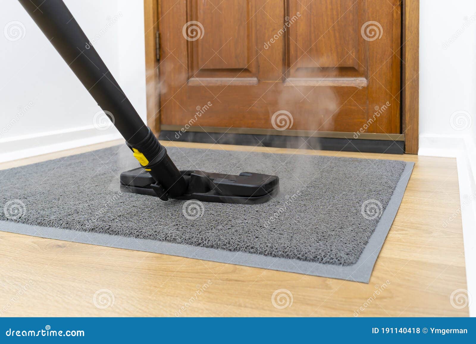 Sanitizing Front Doormat with Steam Cleaner Stock Photo Image of