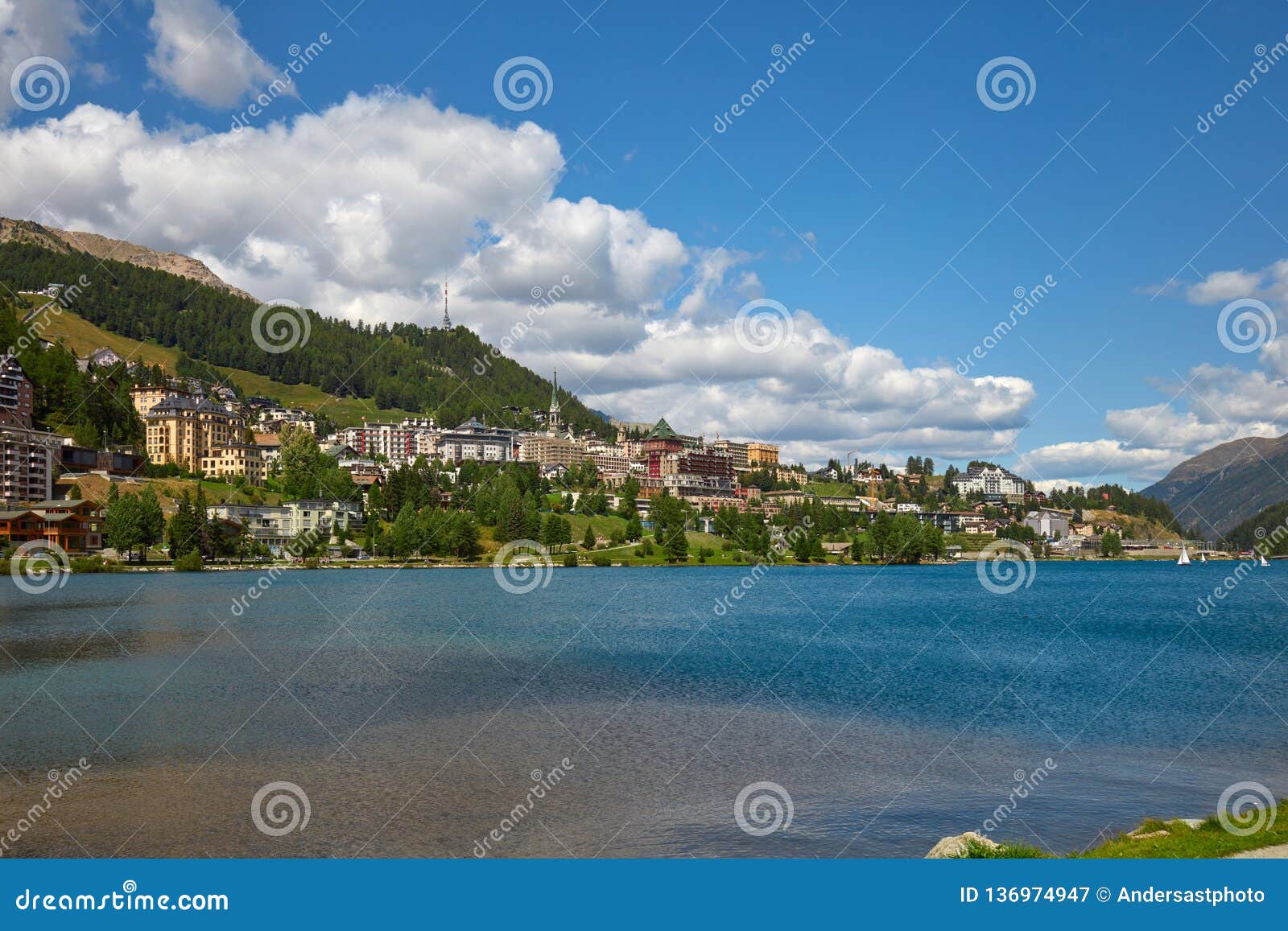 sankt moritz town, lake and green mountain in summer in switzerland