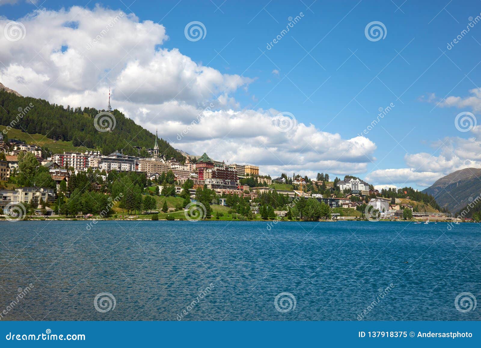 sankt moritz town and lake in a summer day, white clouds in switzerland