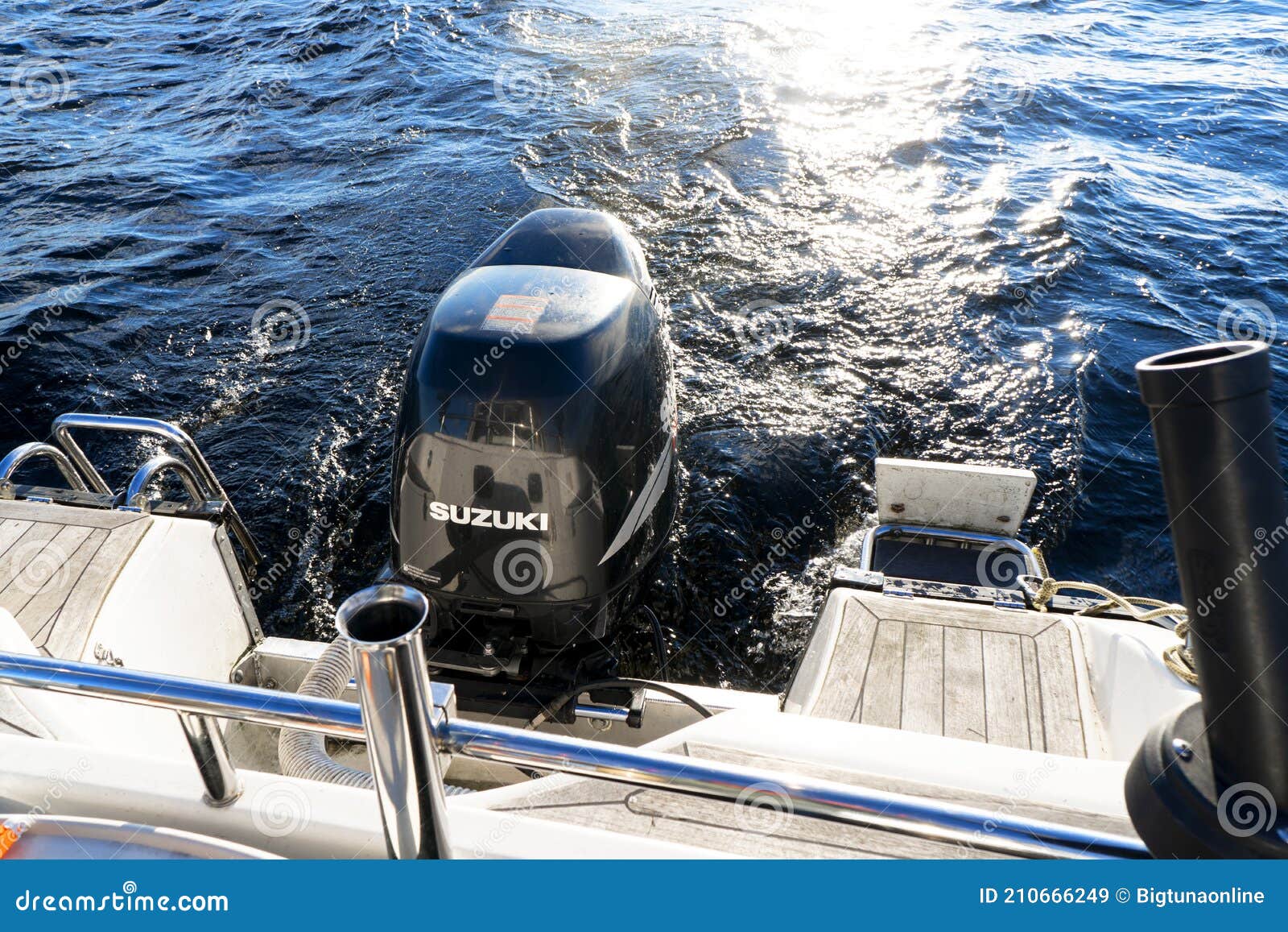 Modern Fishing Sport Boat with a Brand New Suzuki FourStroke Outboard  Engine Speeding on the Lake Editorial Stock Image - Image of fourstroke,  sale: 210666249