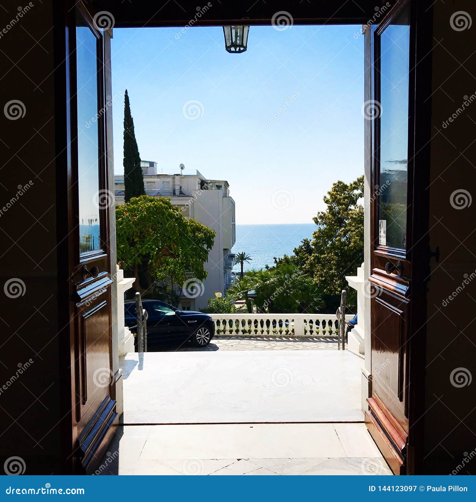View of the Sea Mediterranean through the Open Door Stock Photo