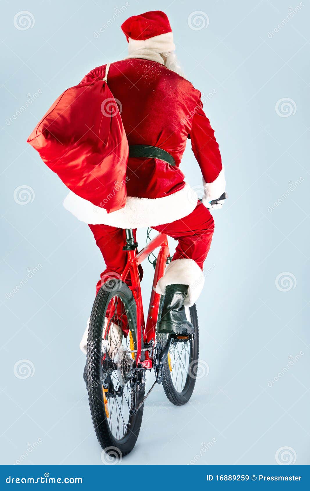 Santa on bike stock image. Image of season, christmastime 16889259