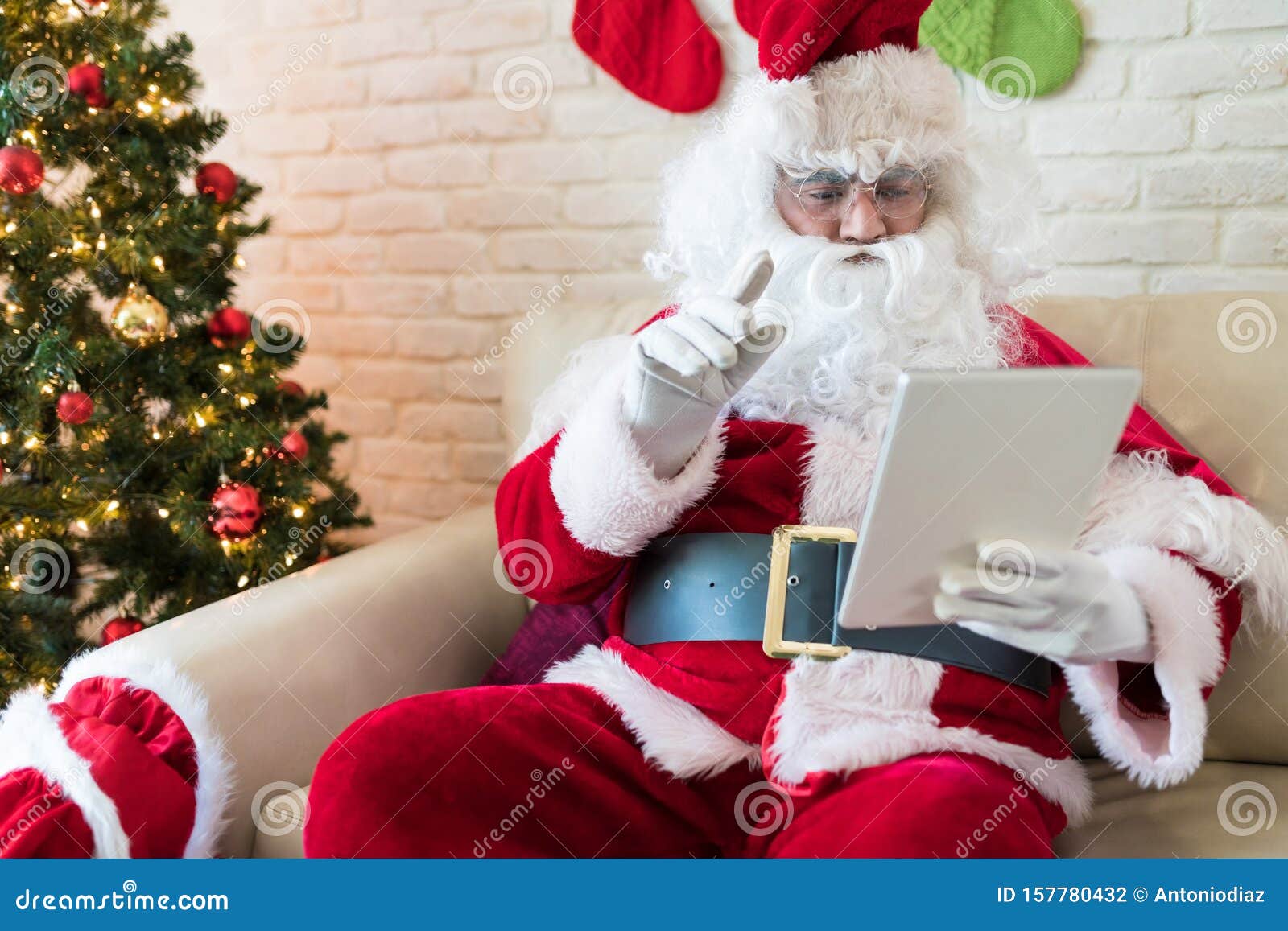 Santa Checking His List On Digital Tablet At Home Stock Photo Image Of Tree Person 157780432