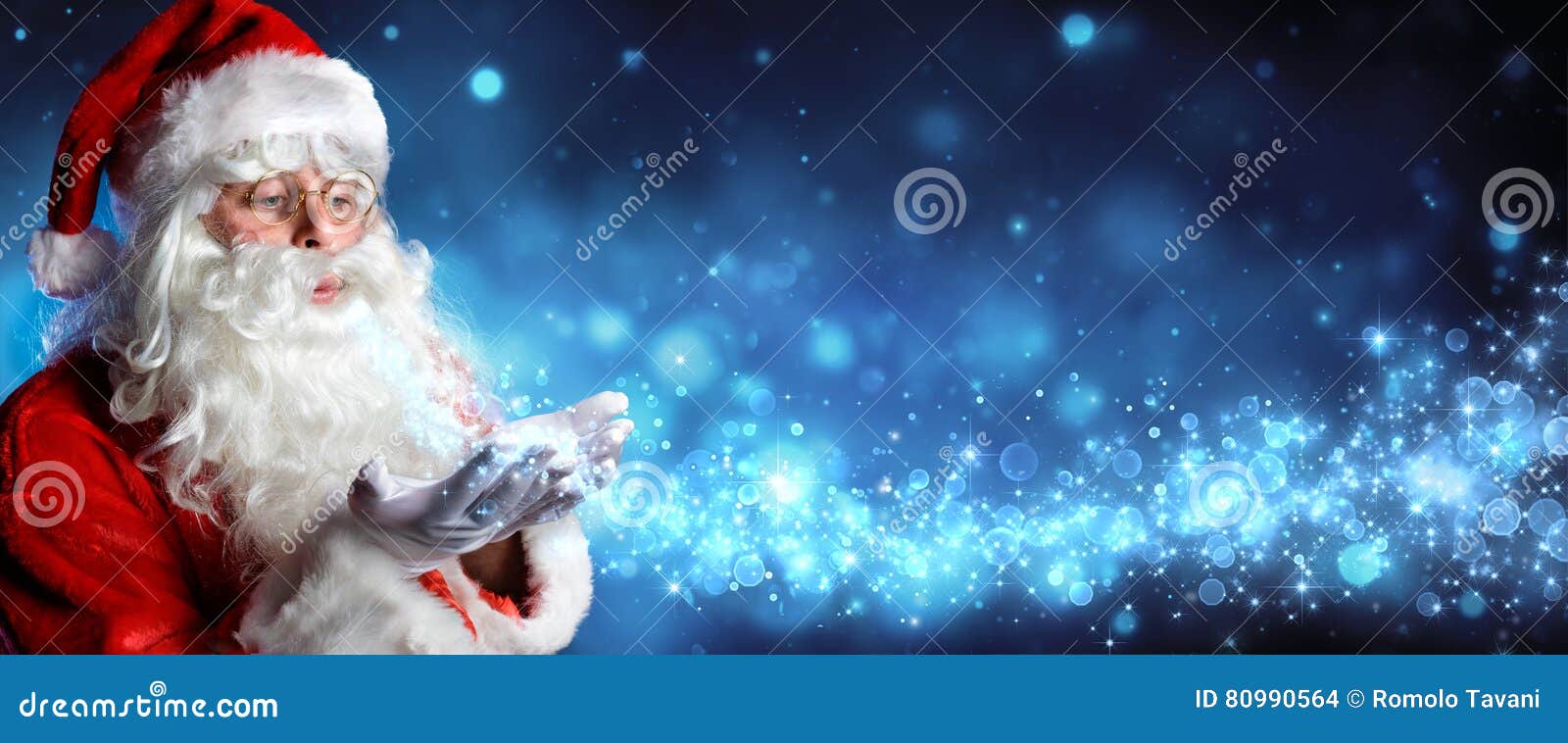 santa claus blowing magic christmas stars