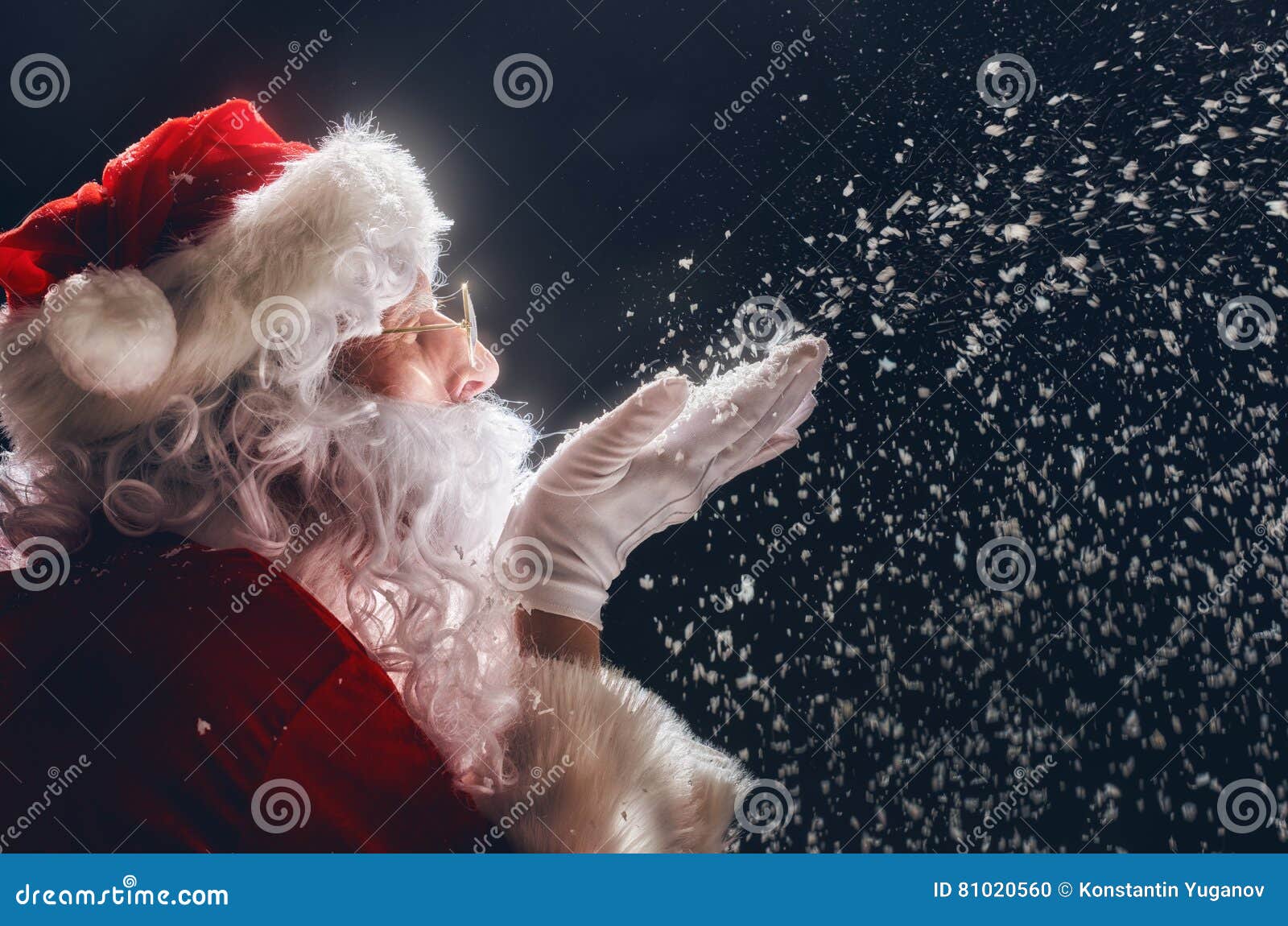 santa claus blows snow.