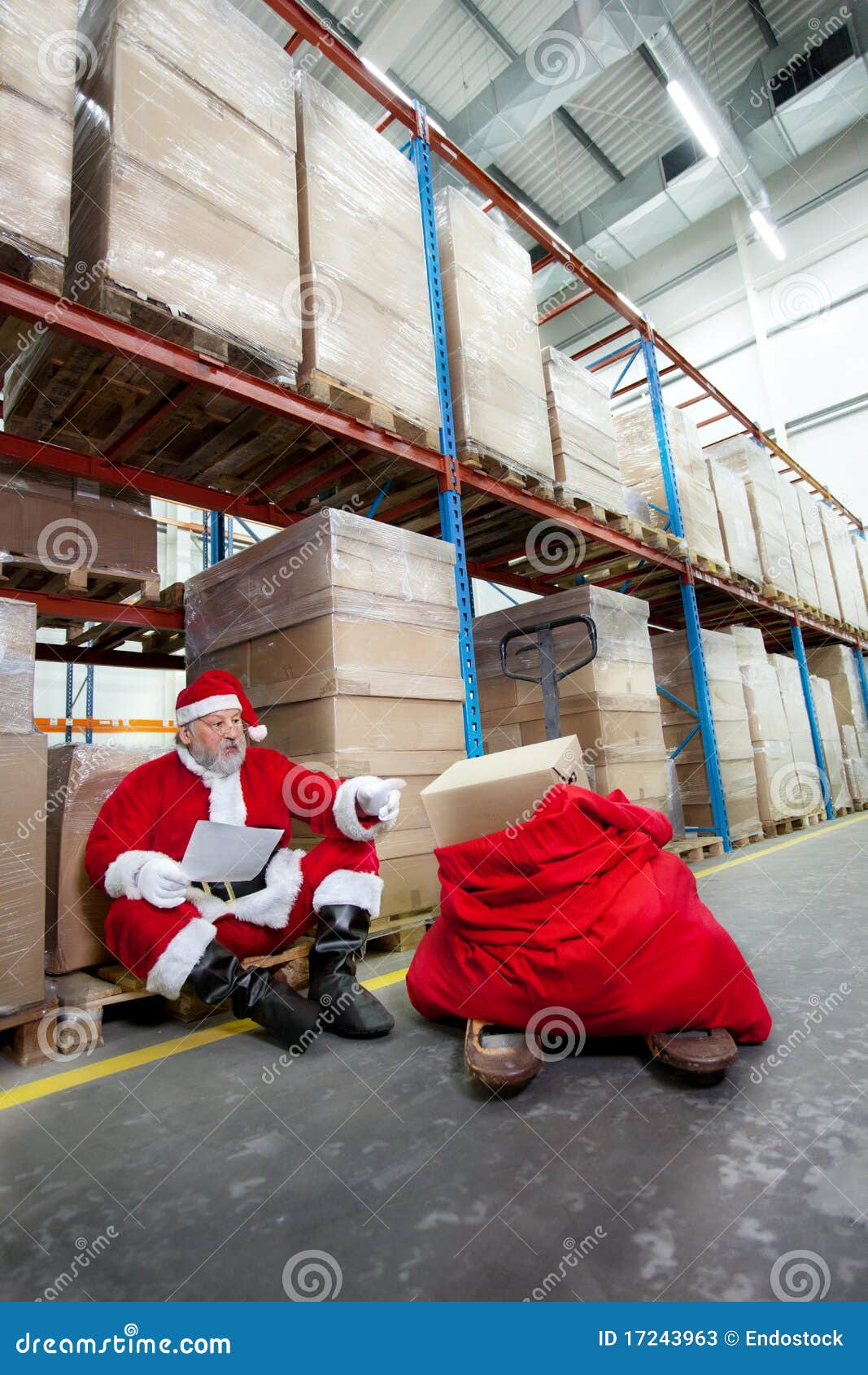 santa claus checking list of gifts in storehouse