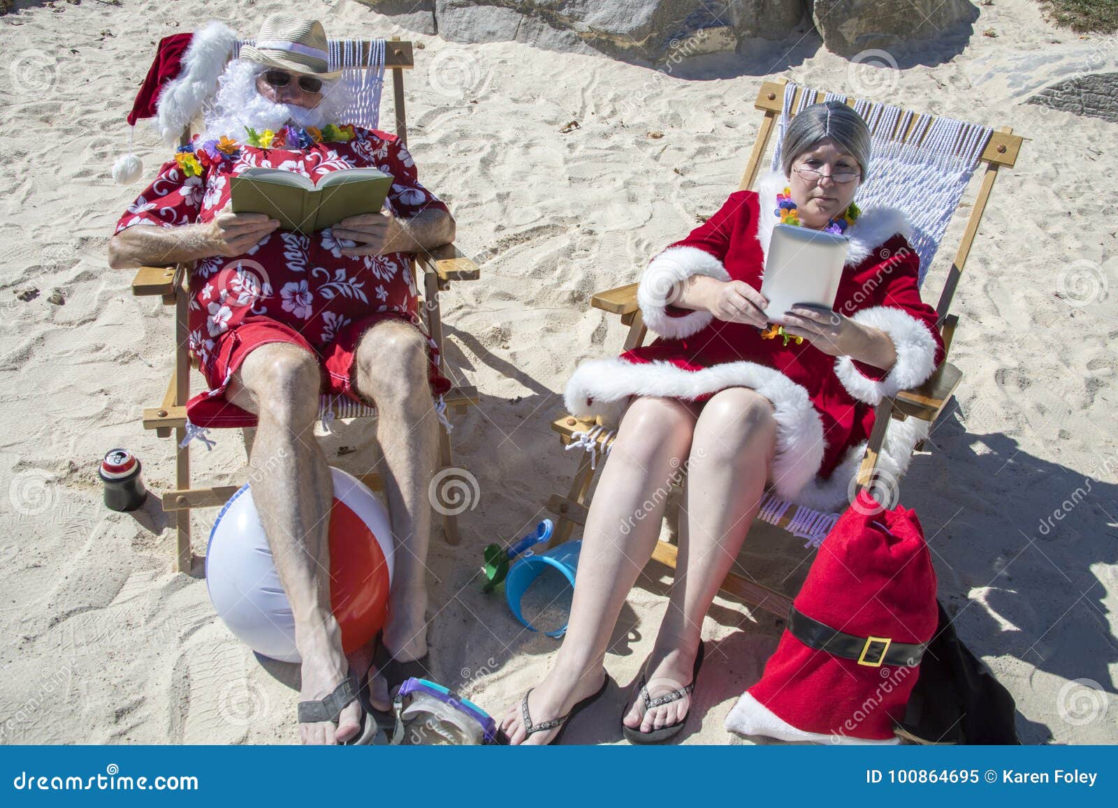 Santa and Mrs Claus Reading Books on Beach Stock Image - Image of ...