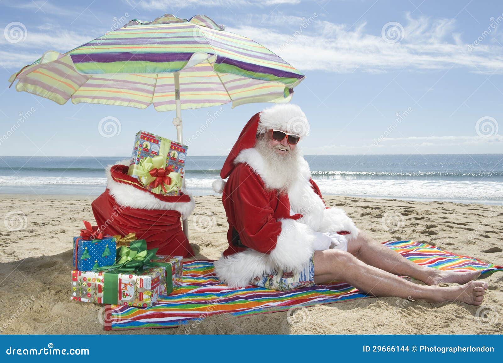 santa claus sitting under parasol gifts beach 29666144