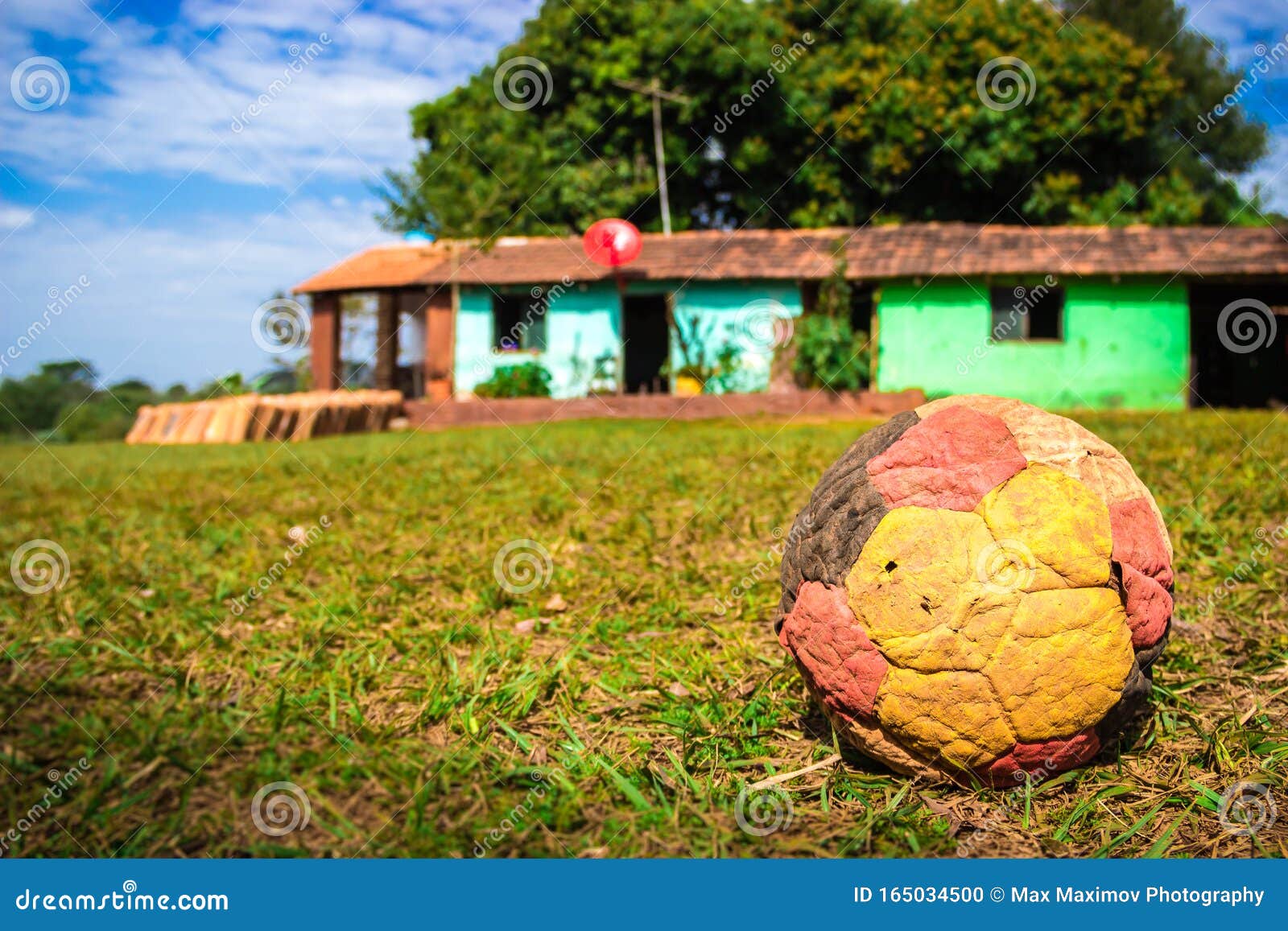 santa maria de fe, misiones, paraguay - deflated football forgotten outside a house in the paraguayan countryside