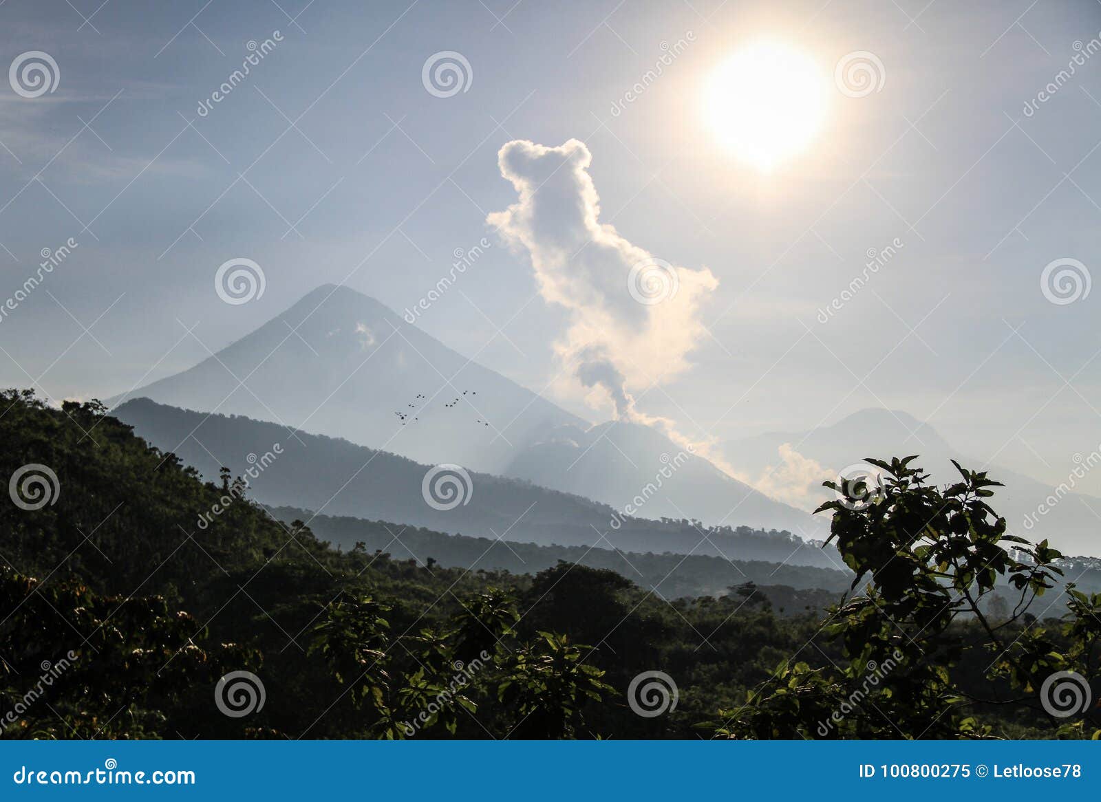 santiaguito erupting with santa maria at the background on a sunny morning, altiplano, guatemala