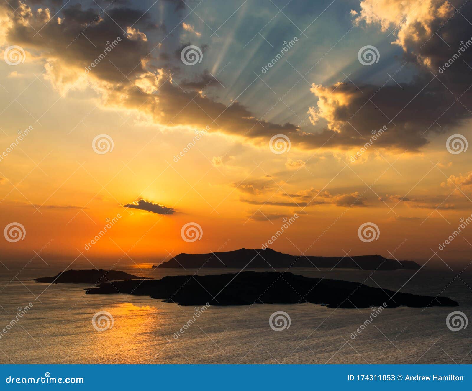 santorini sunset over the caldera viewed from the clifftops near pyrgos