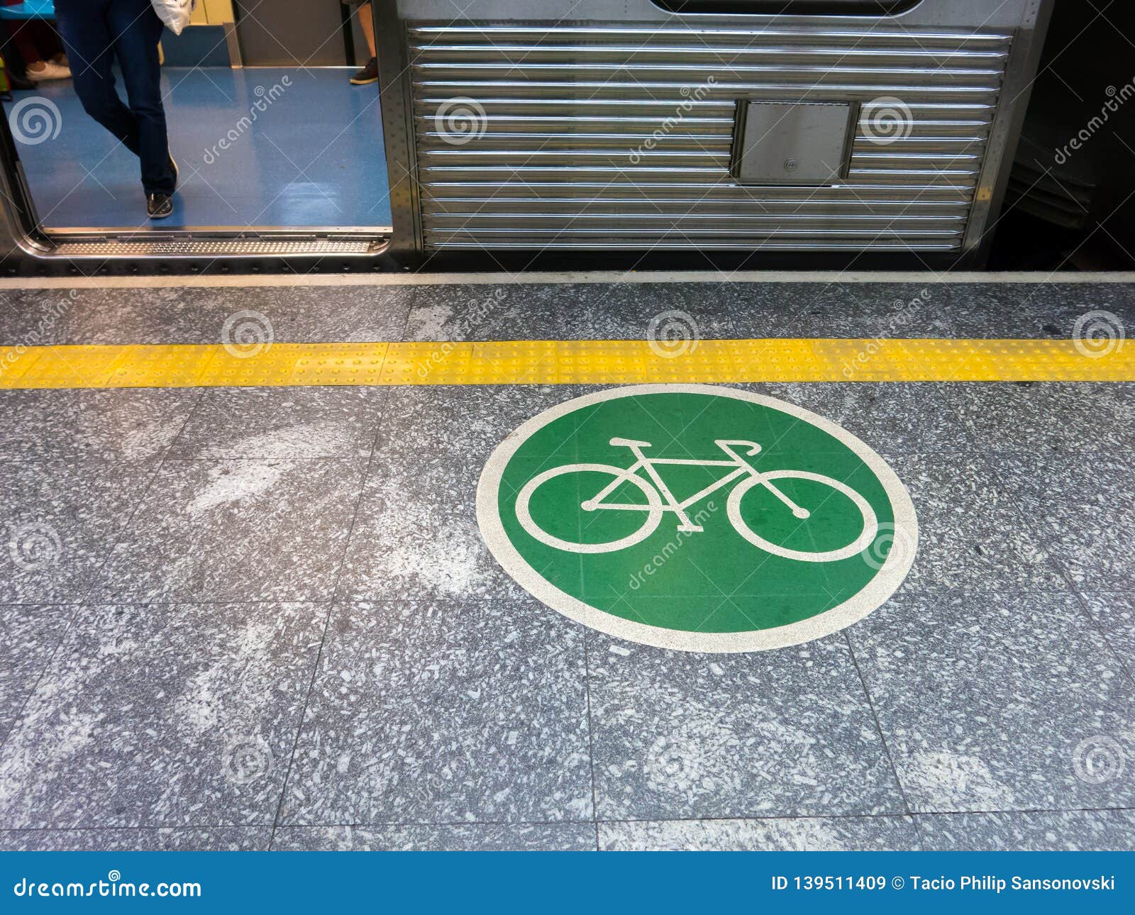 adhesive plate on the ground indicating bicycle access area in brazilian subway