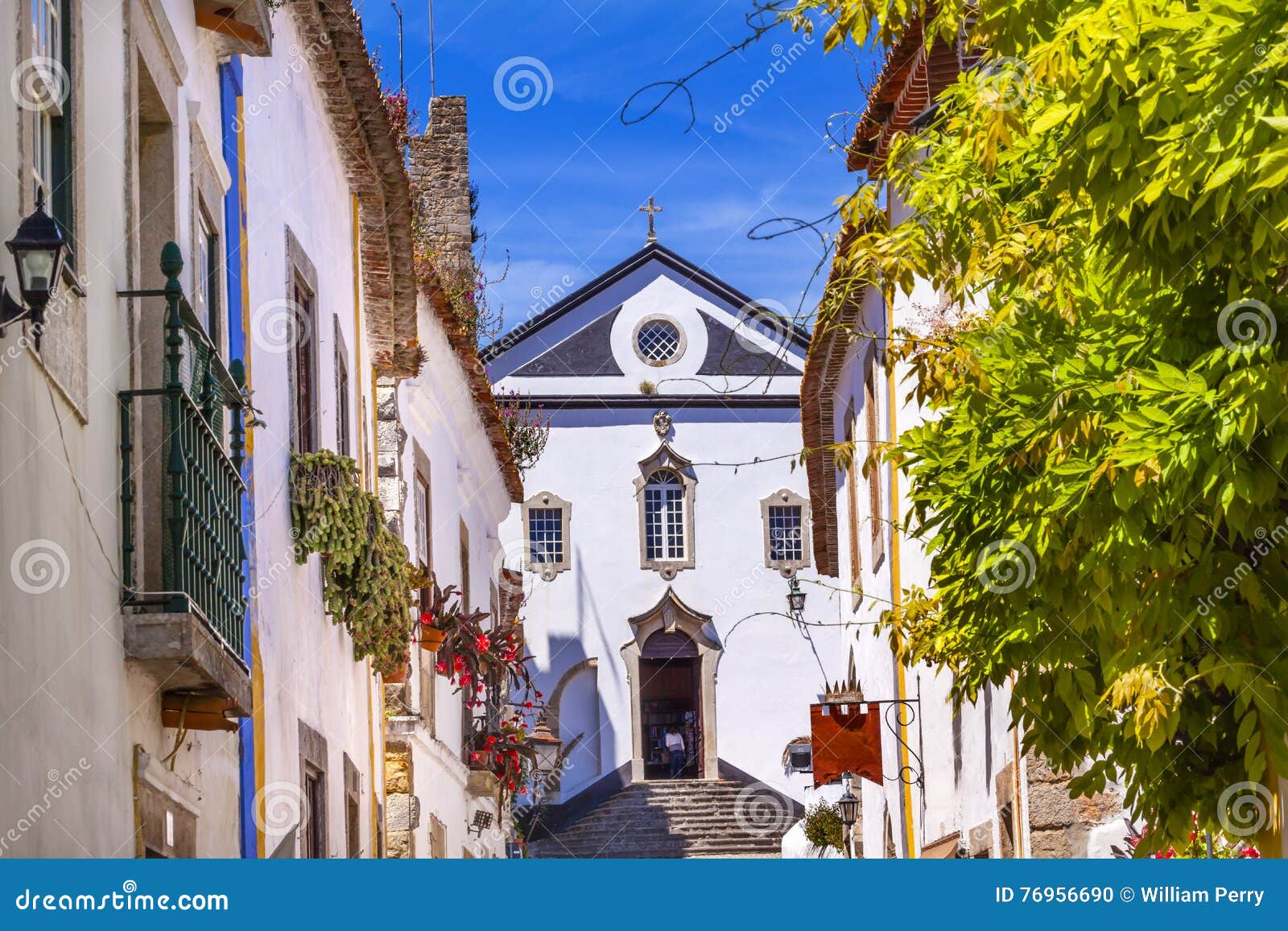 sao pedro church narrow white street obidos portugal