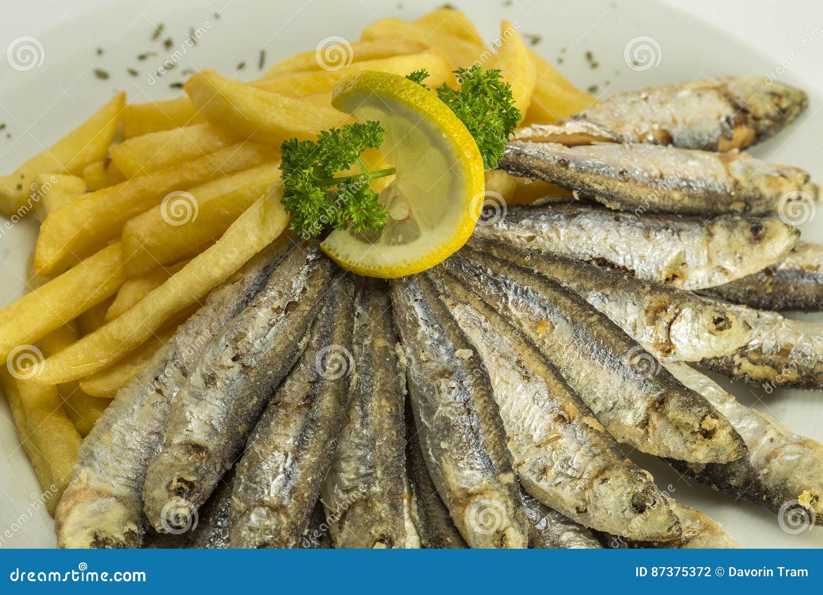 Sardines on a plate stock photo. Image of anchovy, appetizer 87375372
