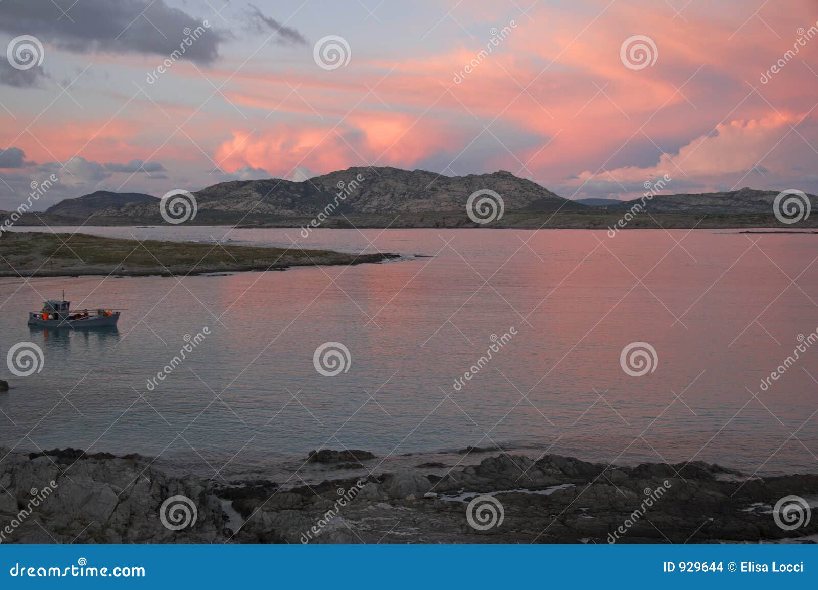 The sunset is reflected on the Beach of Masua, Iglesias