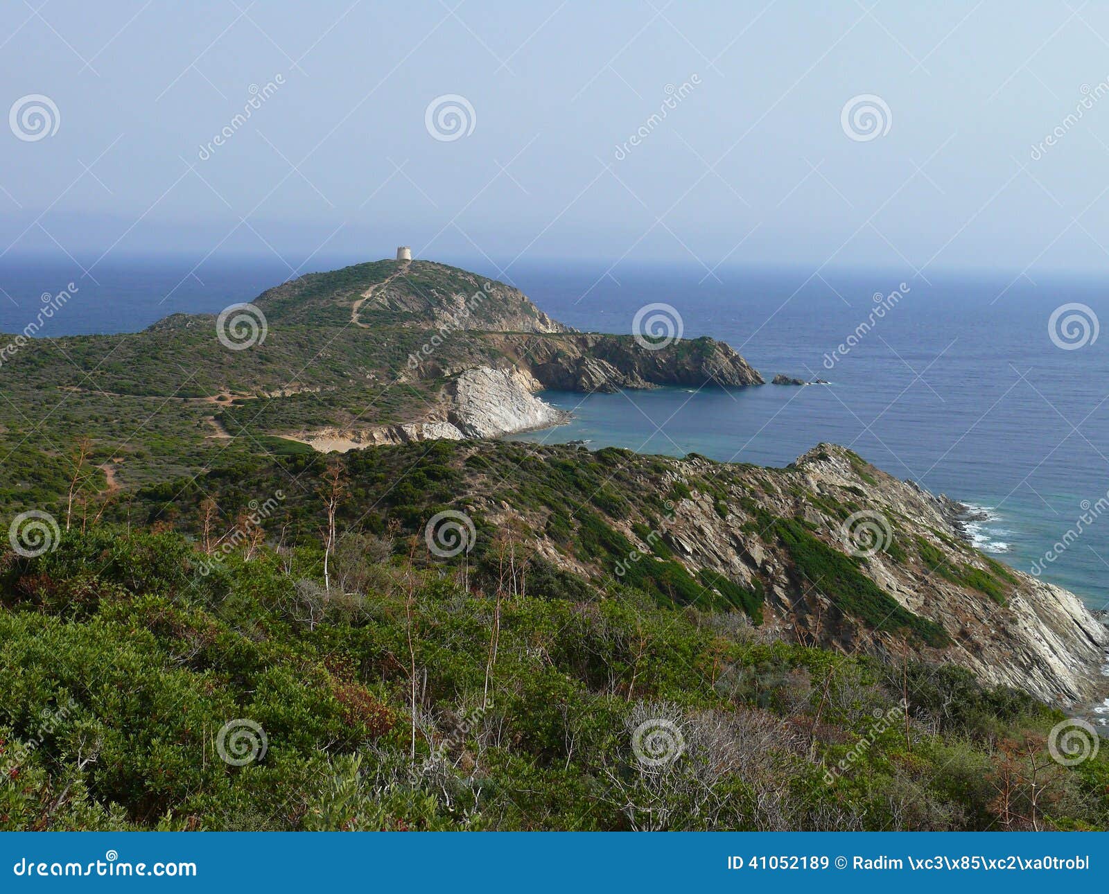 sardinian coastal cliffs and tower overlooking the tyrrhenian sea