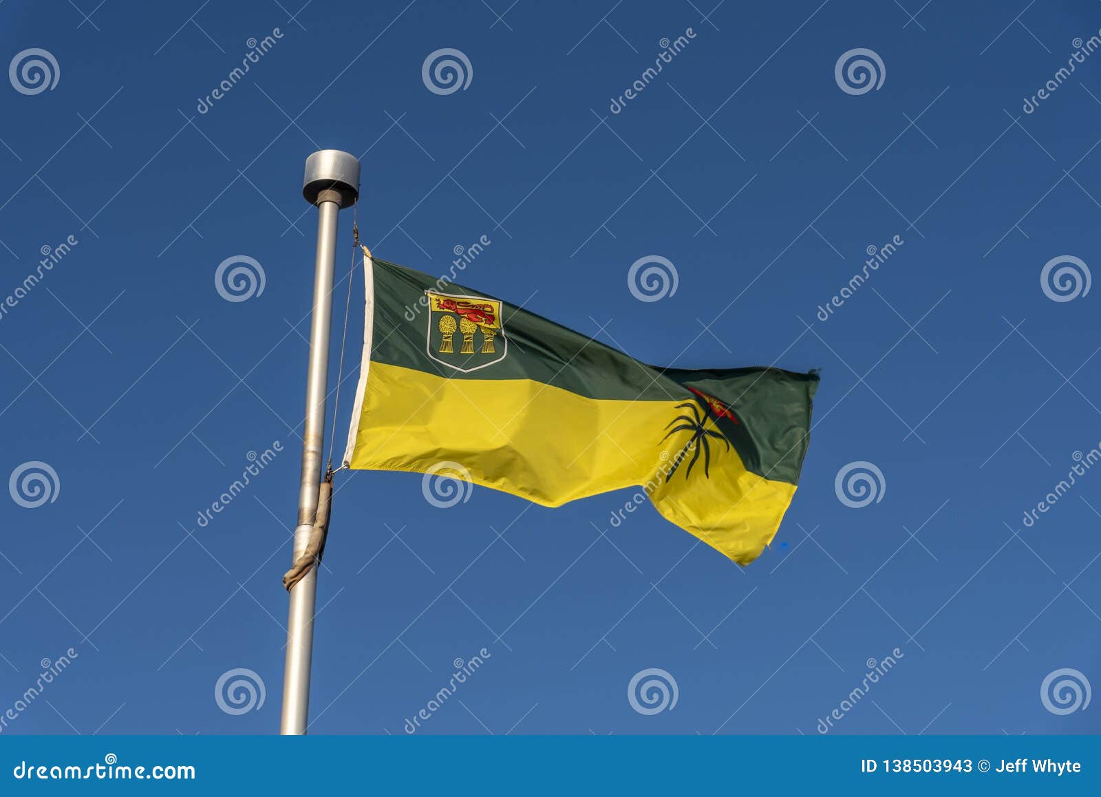 saskatchewan flag against blue sky