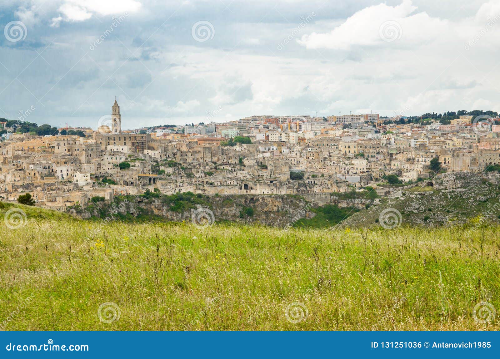 Sassi di Matera historical centre Sasso Caveoso, Basilicata, Italy. Matera panoramic view of historical centre Sasso Caveoso old ancient town Sassi di Matera with cave rock houses with dramatic sky, view from Murgia Timone, UNESCO Heritage, Basilicata, Southern Italy