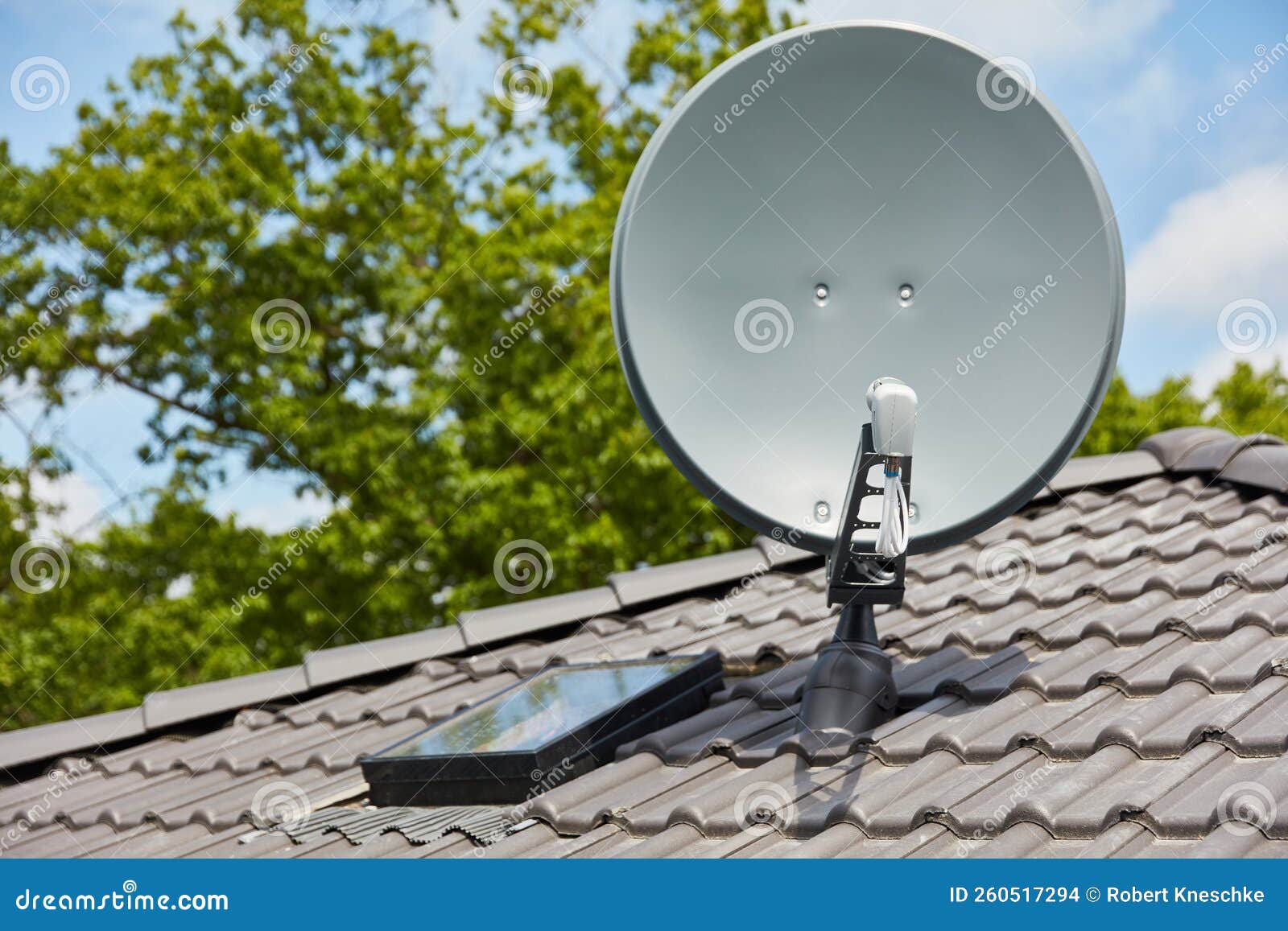 Satellite Dish on the Roof for Satellite TV Reception Stock Photo