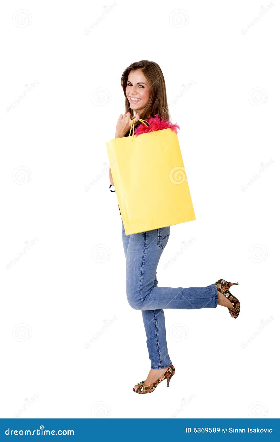 Satisfied. Woman holding a shopping bag
