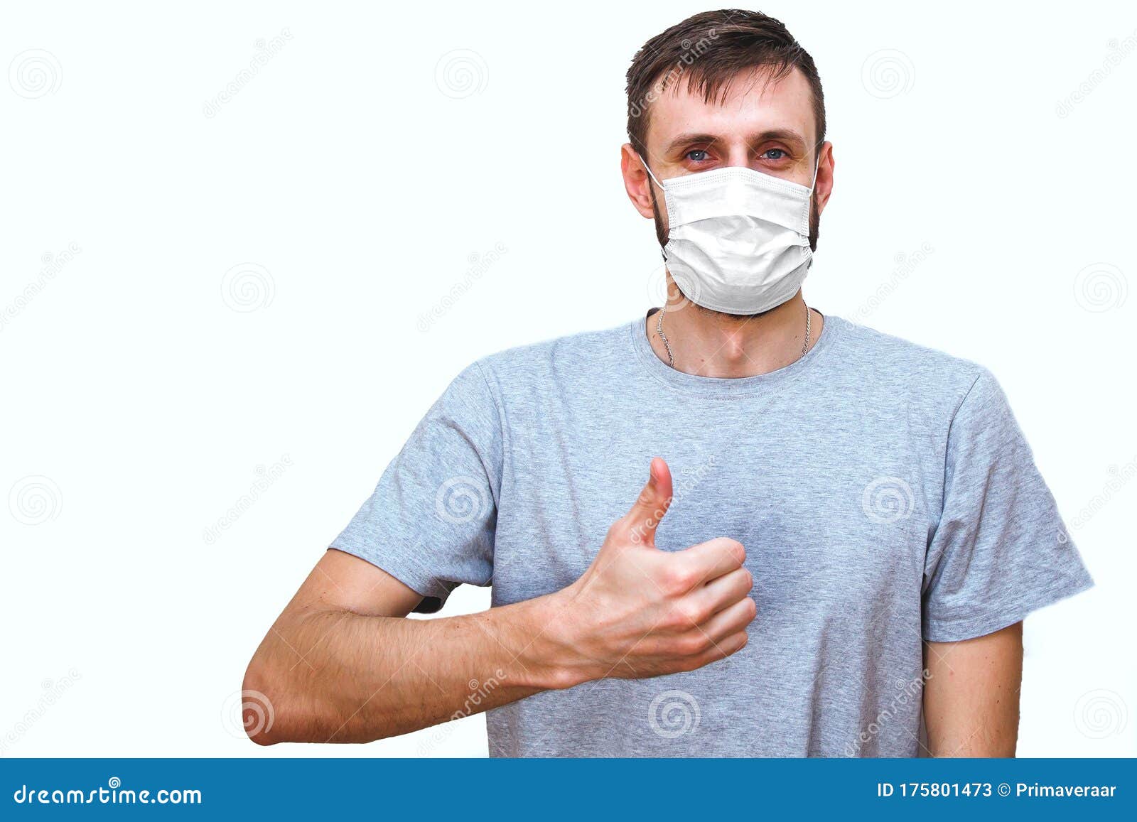 Satisfied Man in Medical Mask on His Face Showing Thumbs Up on a White ...