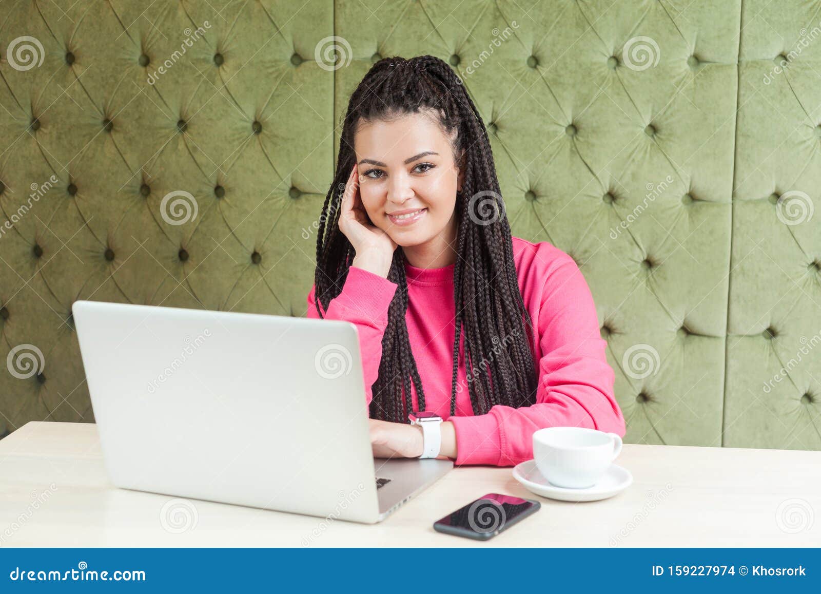 Satisfied Young Girl Freelancer With Black Dreadlocks