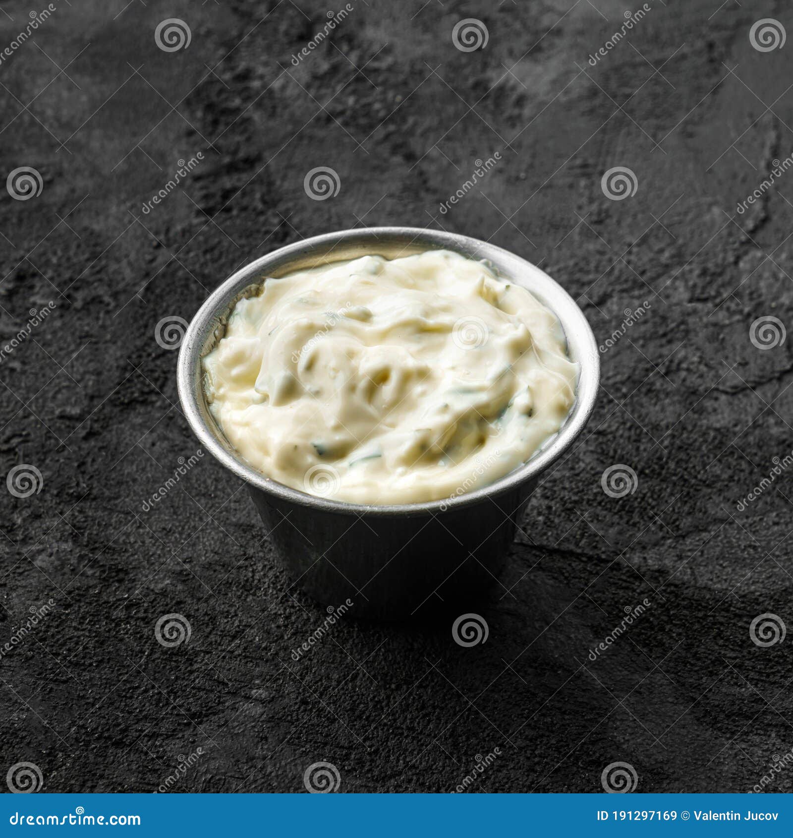 Sauce with Garlic and Mayonnaise in Bowl on Black Stone Background