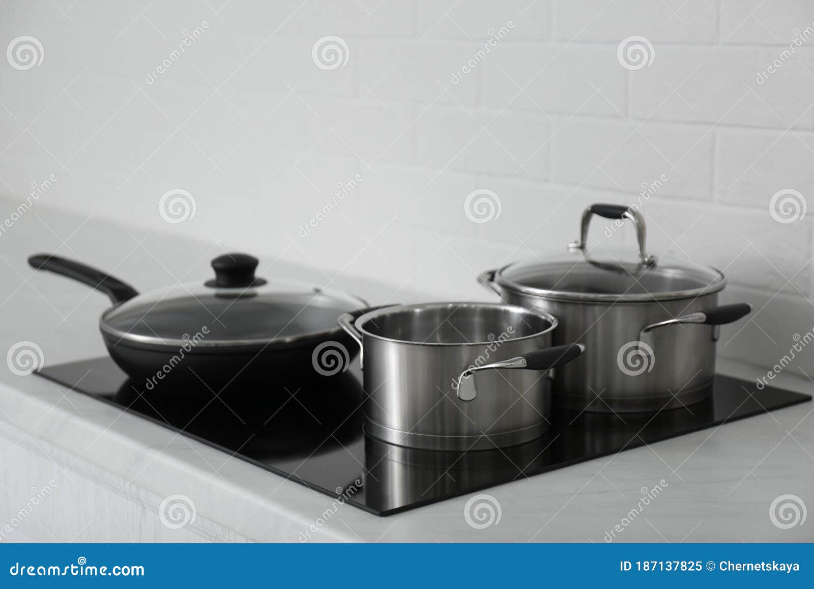 Saucepots and Frying Pan on Induction Stove Stock Image Image of