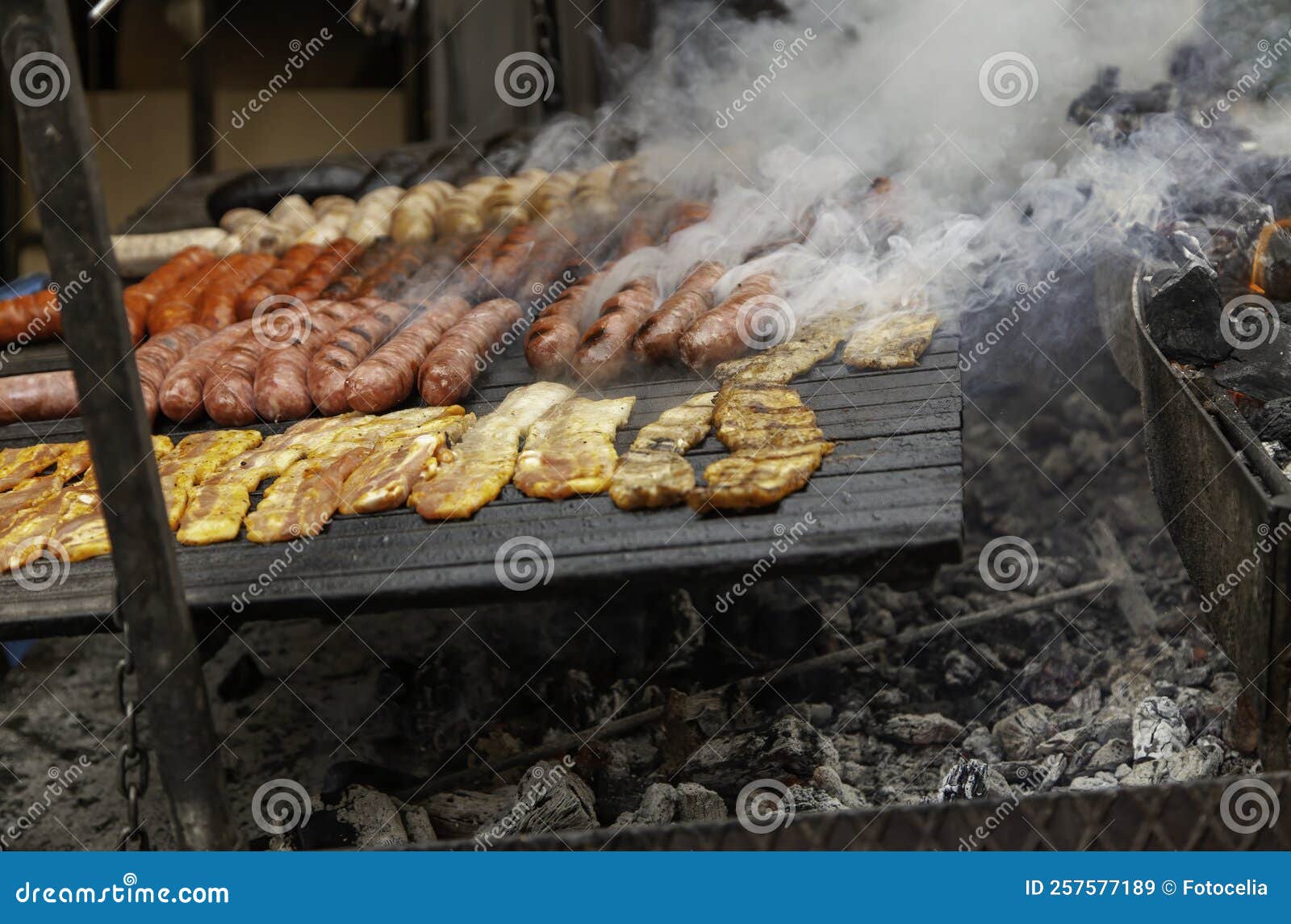 Sausage frying in pan stock image. Image of chicken 257577189