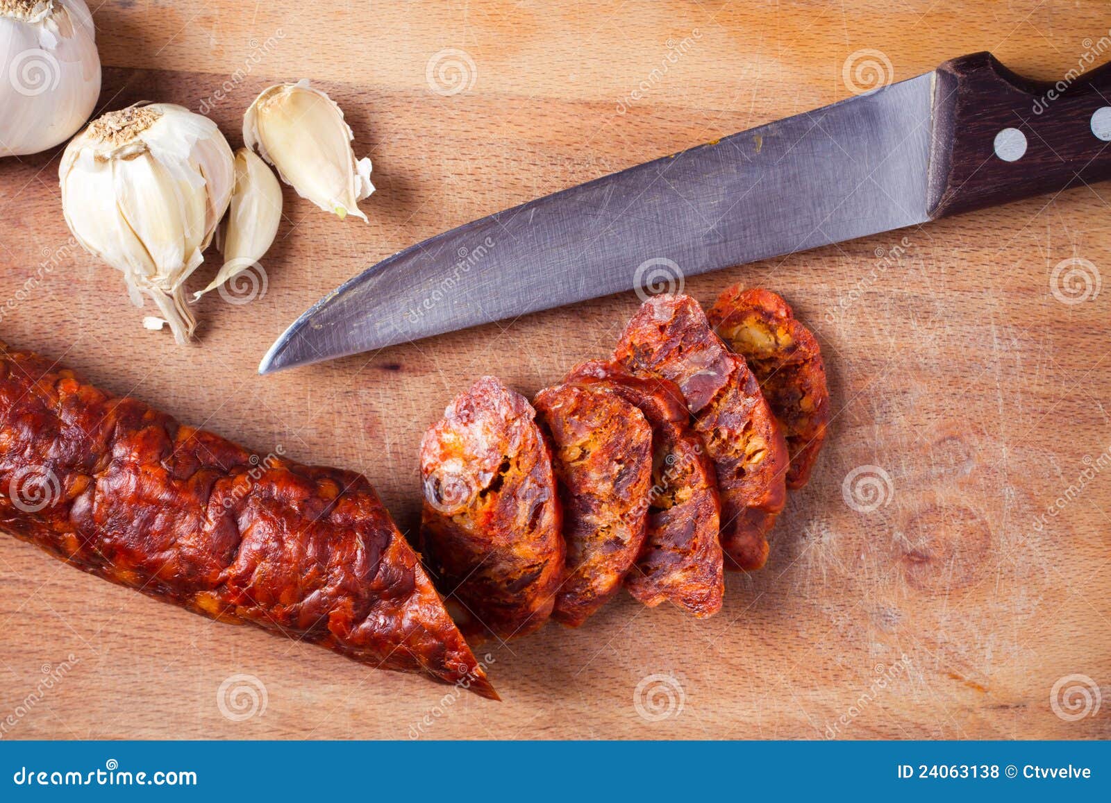 Sausage, garlic and knife stock photo. Image of grease 24063138