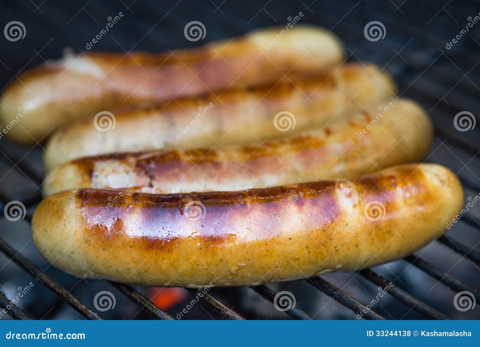 Sausages on charcoal grill stock photo. Image of barbecuing 33244138