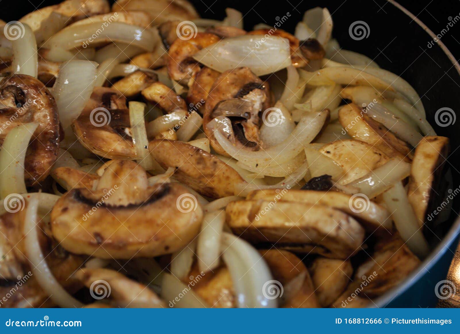 sauteing mushrooms and onions in a frying pan with oil, seasoning, and steam