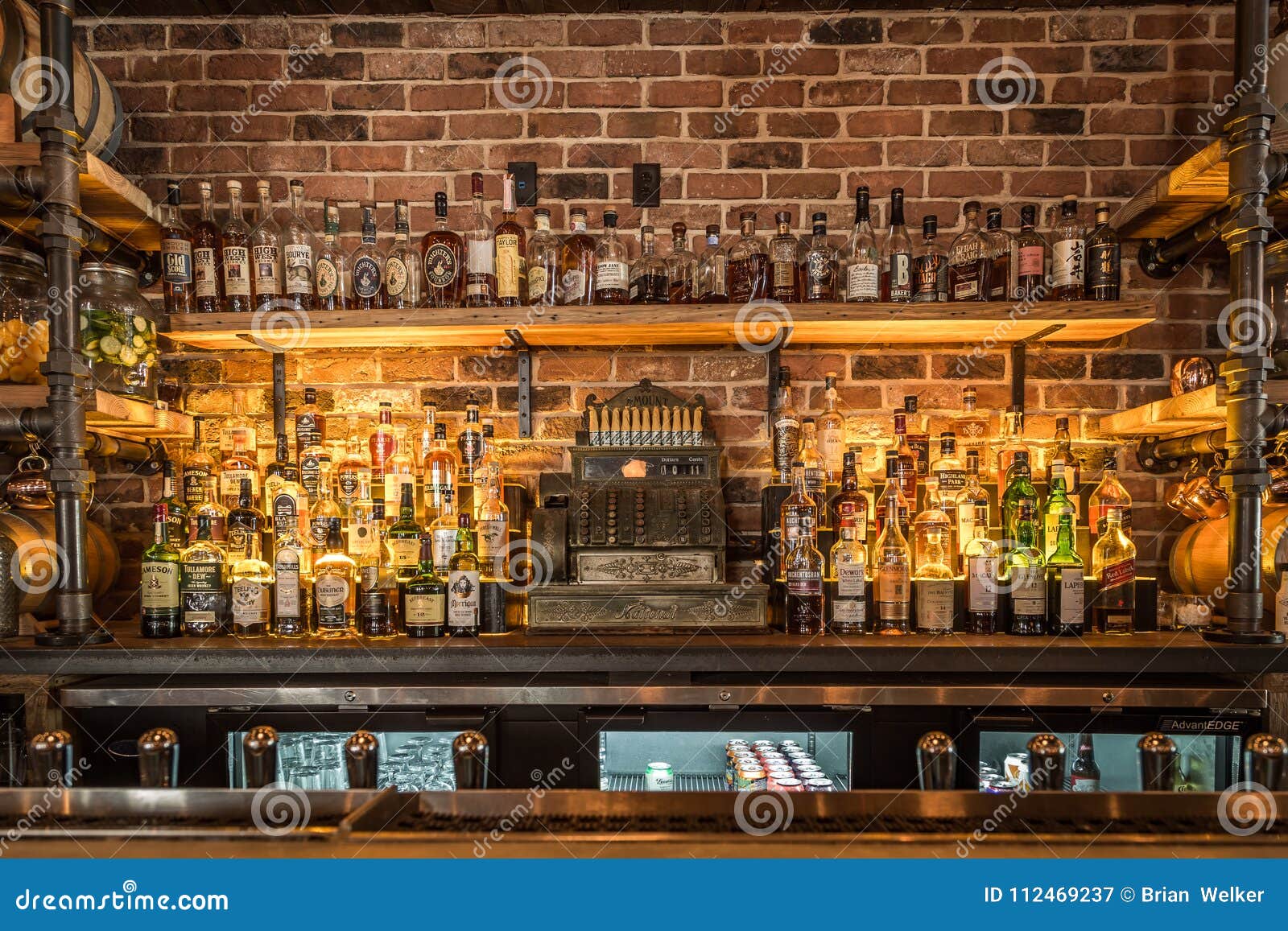 Liquor bottles in a bar editorial photography. Image of whisky 112469237