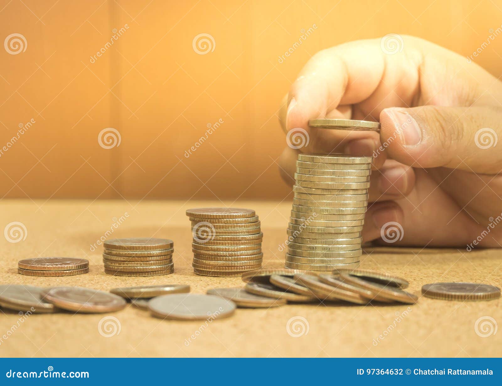 save money concept preset by hand putting money coin stack gro