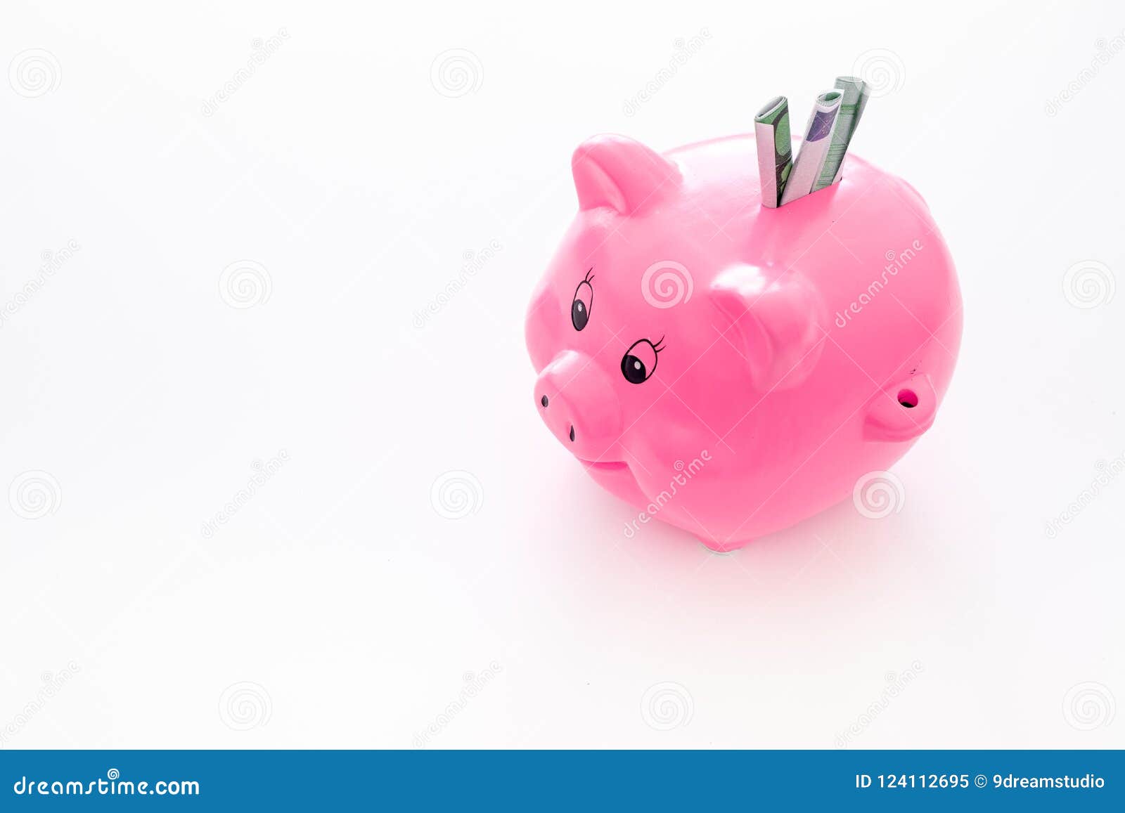 Savings. Moneybox in Shape of Pig with Banknotes Falling into it on
