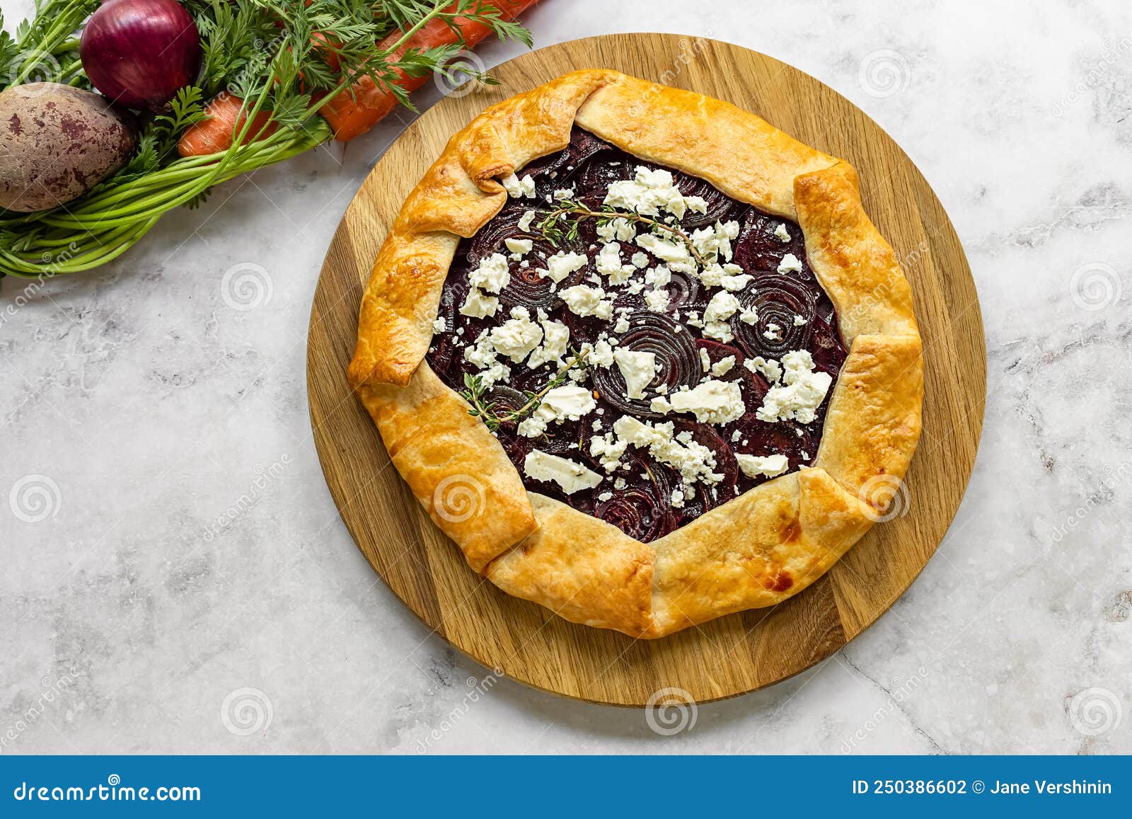 Savory Root Vegetable Galette. Served with Goat Cheese. Stock Photo