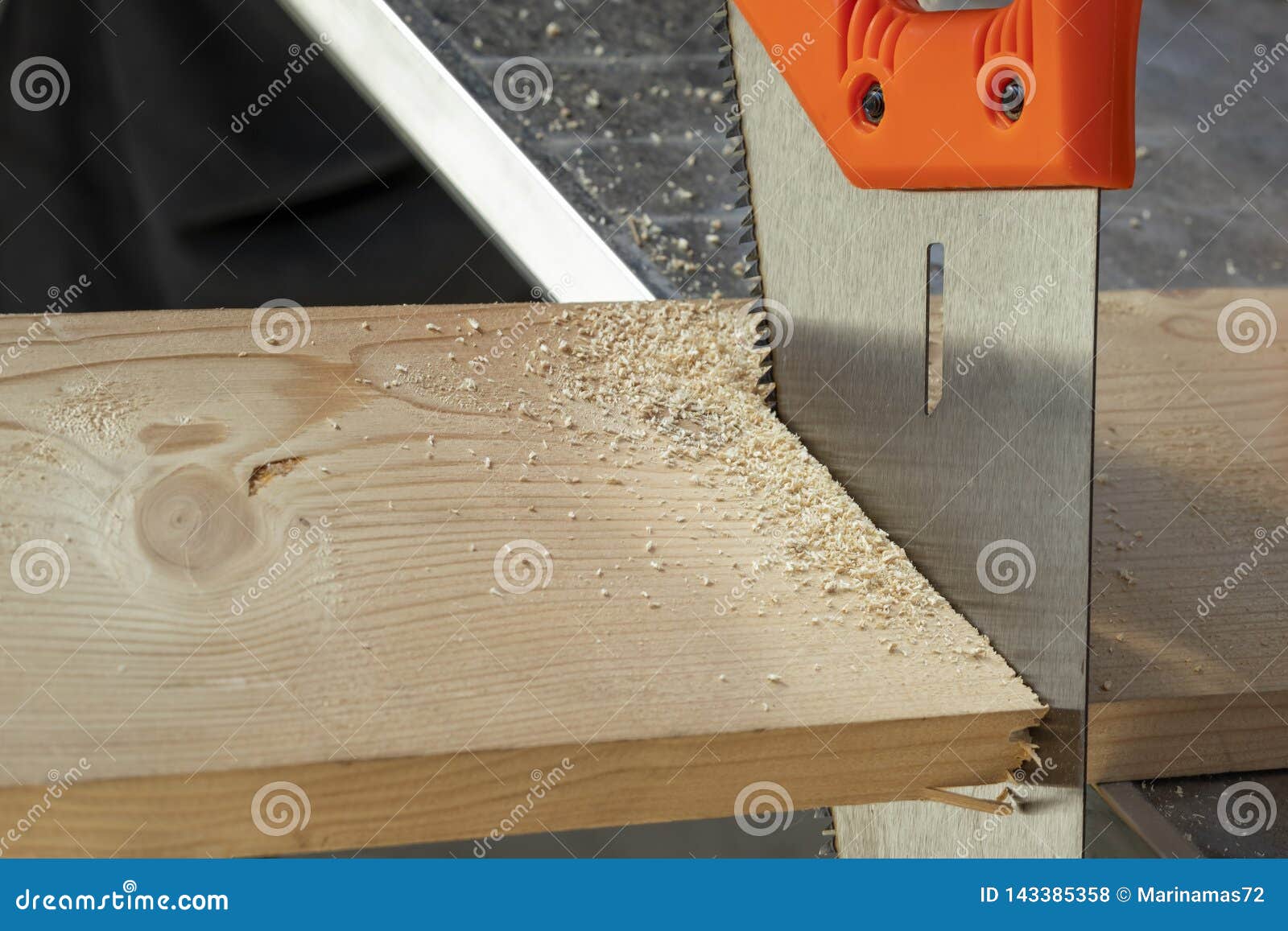 Saw Cutting through a Board. Stock Photo Image of industry, hardware