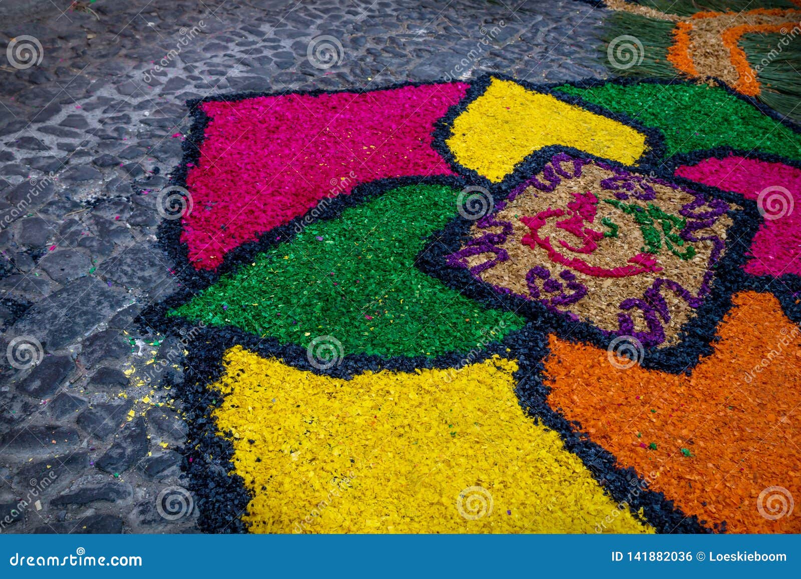 sawdust alfombra for semana santa on cobbled street, antigua, guatemala