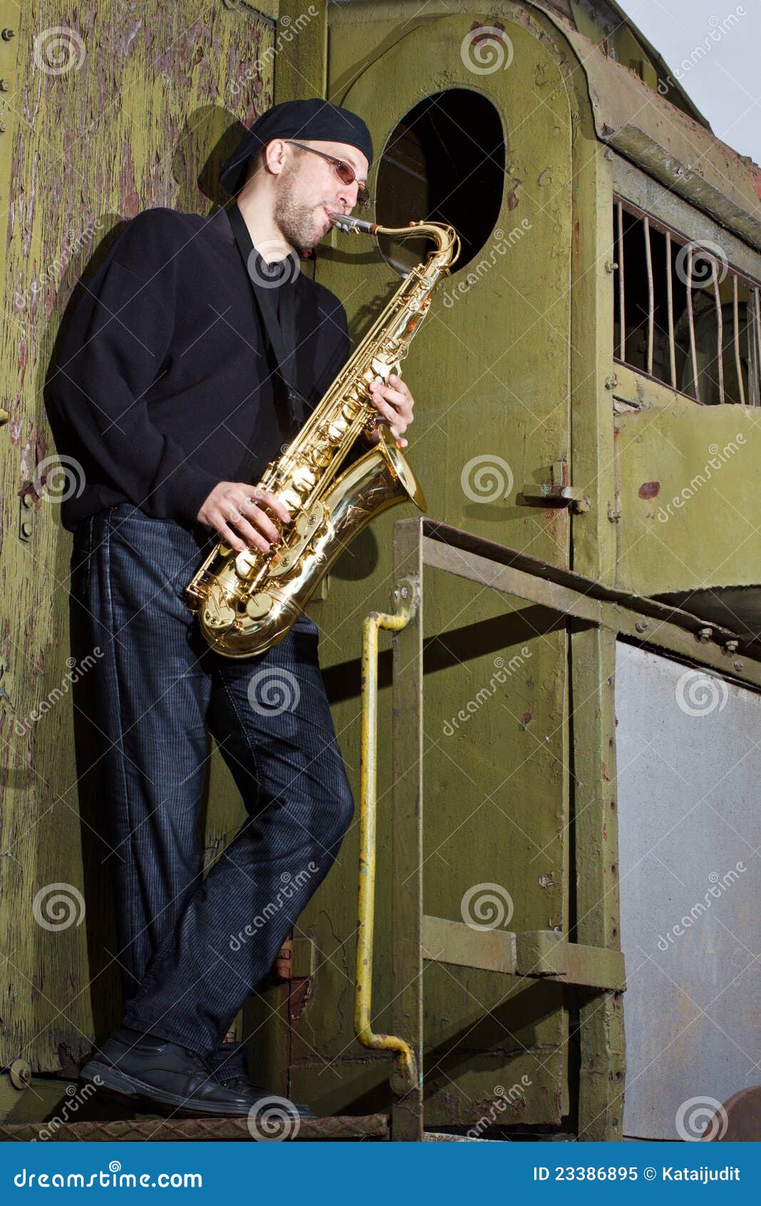 Saxophone player outdoors stock image. Image of musical 23386895