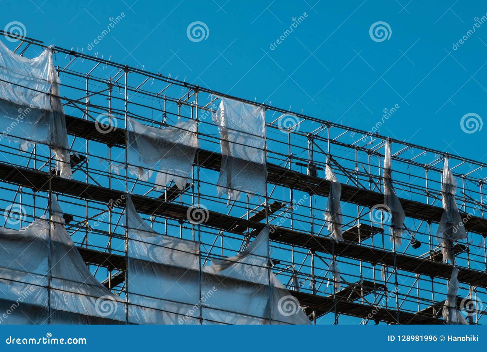 Scaffolding On Blue Sky Background - Construction Frame - Stock