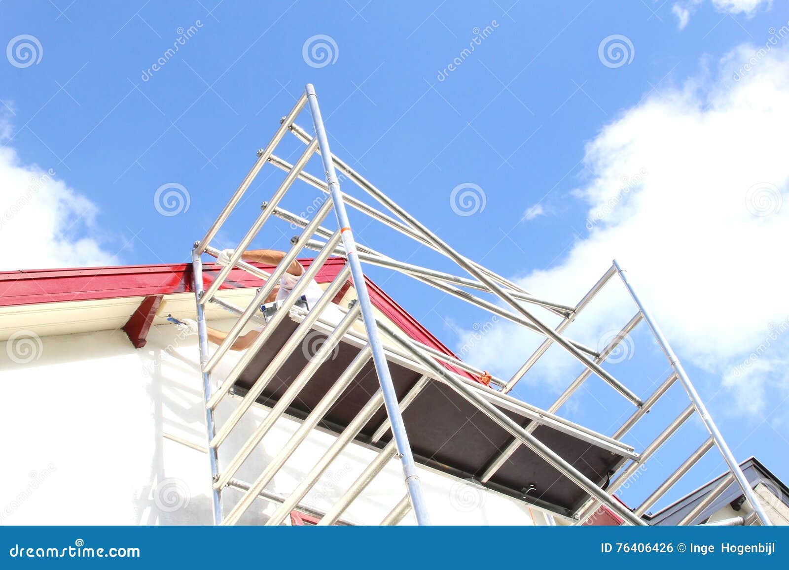 scaffolding tower worker rooftop painting house, netherlands