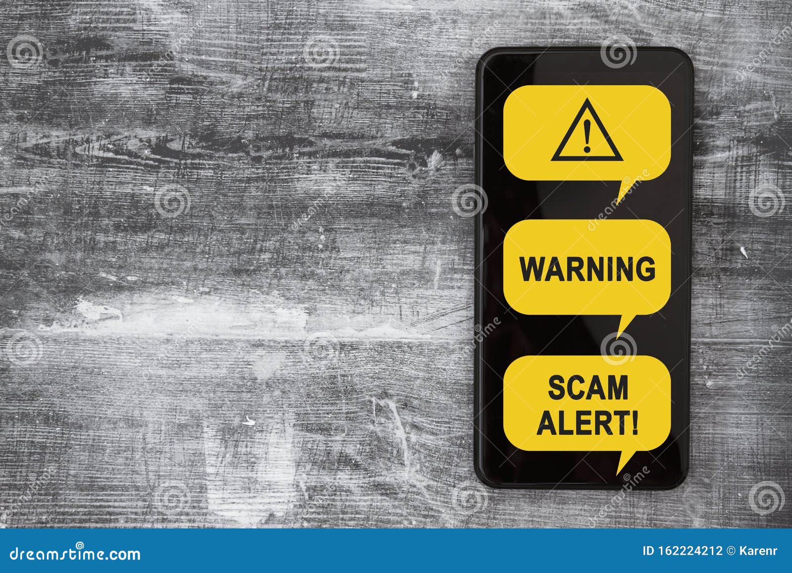 scam alert message on a screen of black cell phone