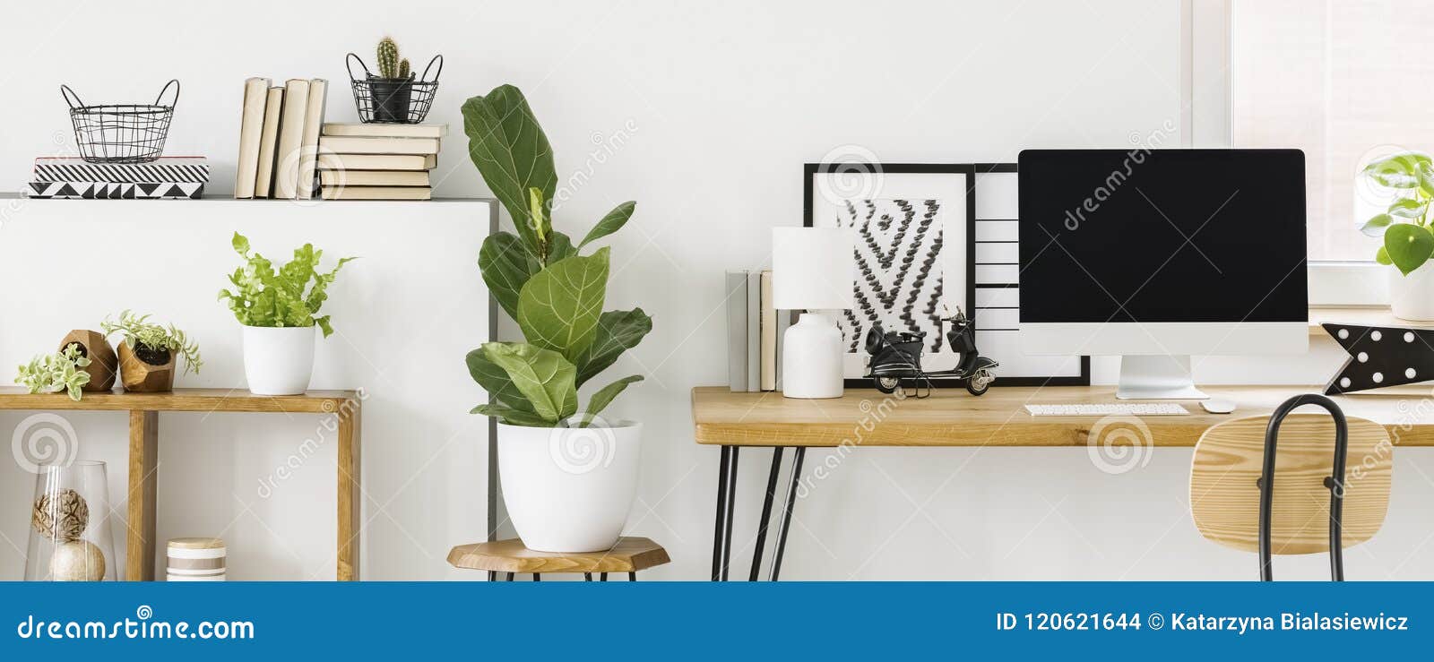 scandi home office interior with a desktop computer on a wooden