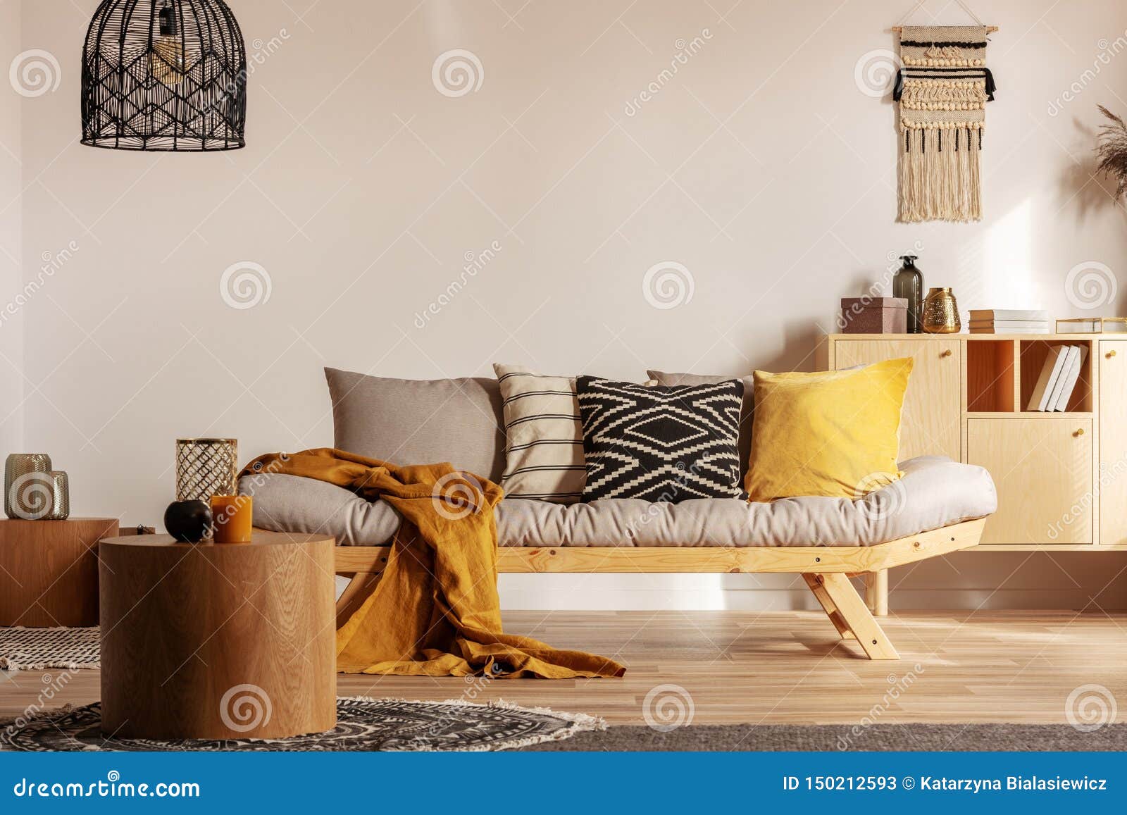 Scandinavian Sofa With Pillows And Dark Yellow Blanket In 