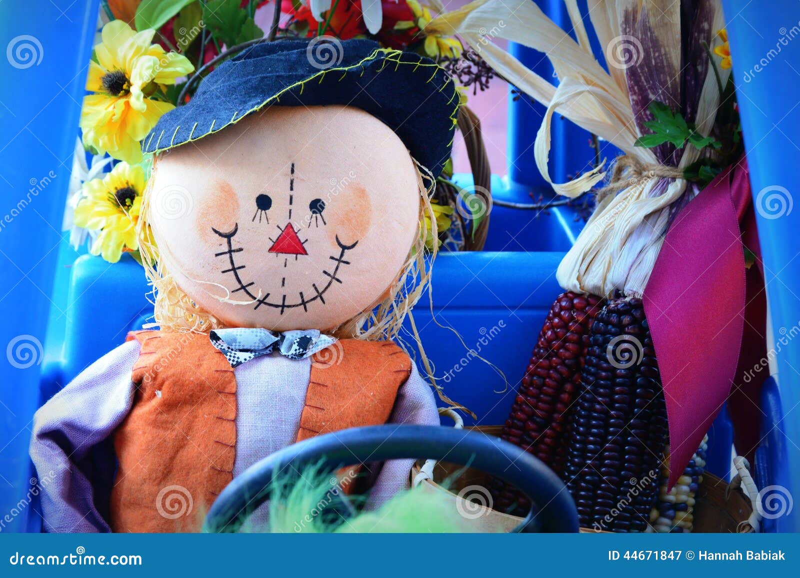 scarecrow driving childs car